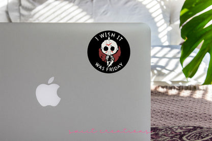 I Wish It Was Friday sticker on the lid of a silver laptop