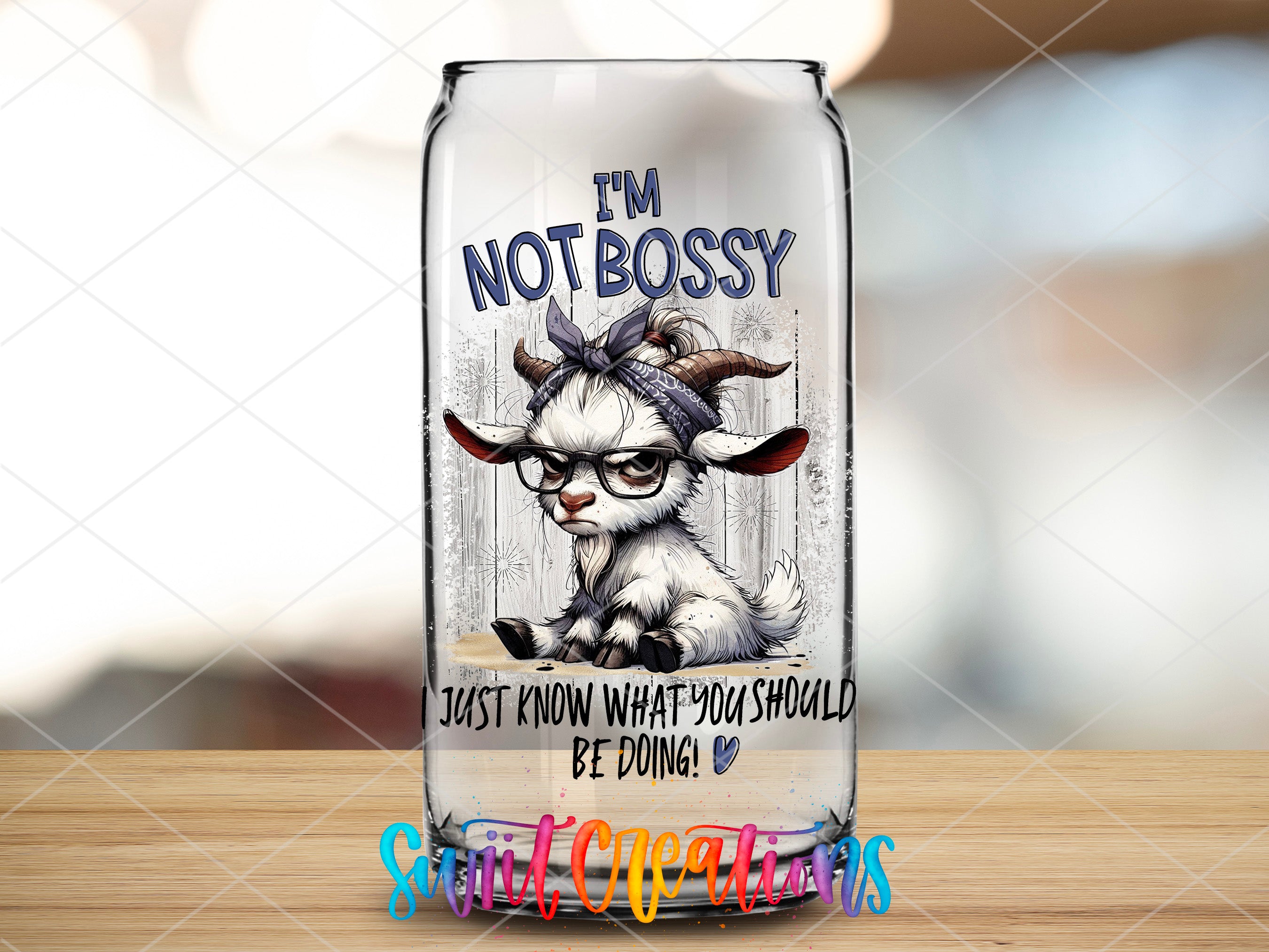 a glass bottle with a picture of a cow on it