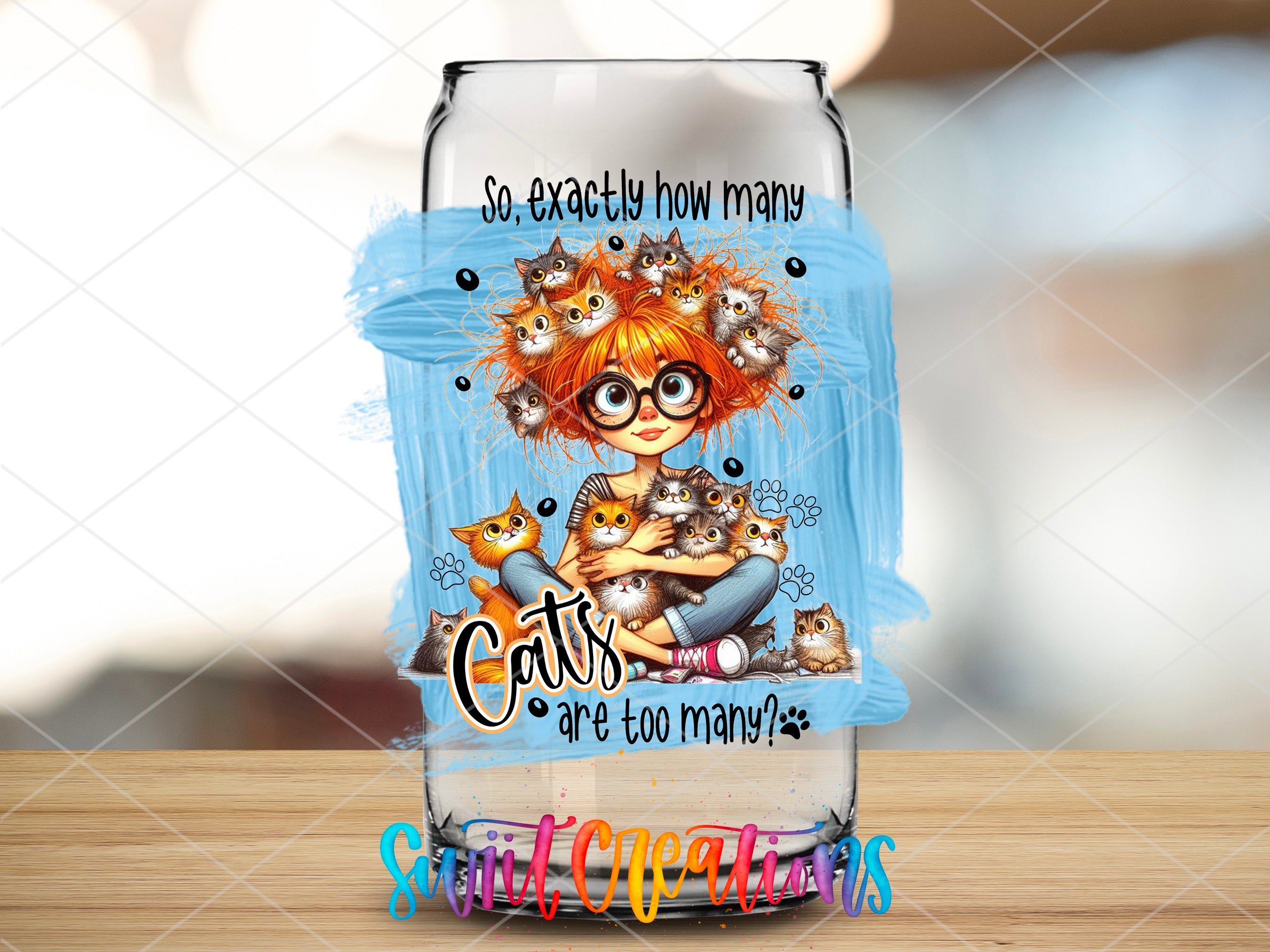 a glass bottle with a picture of a girl and cats on it