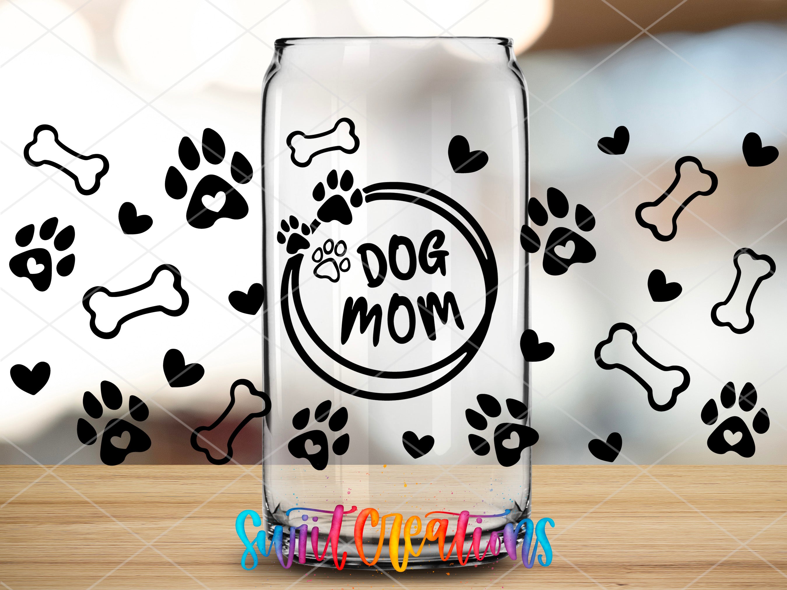 a glass jar with a dog mom design on it