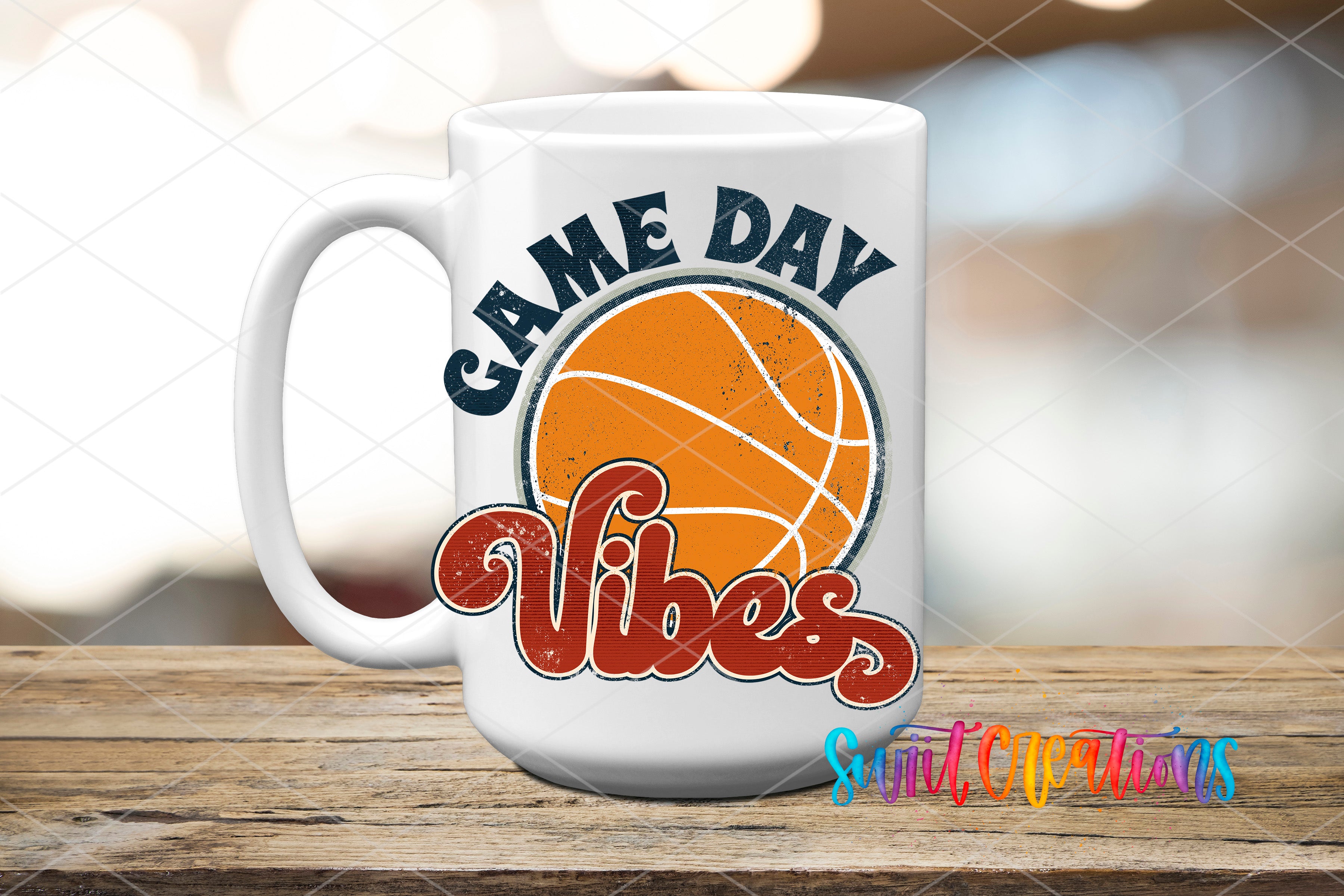 A white mug with a basketball design and the text "GAME DAY VIBES" printed on it, placed on a wooden surface.