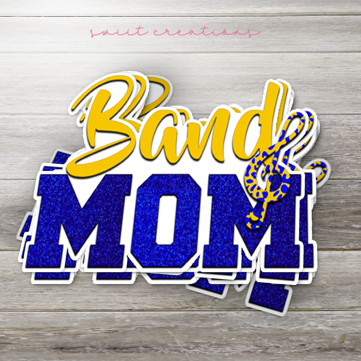 Stack of Gold and Blue Band Mom glossy stickers on a gray wood table