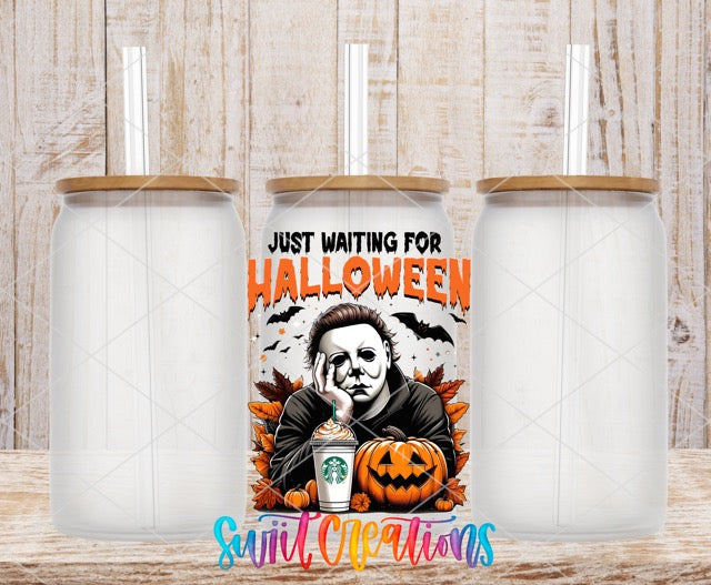 two white coffee mugs with halloween images on them