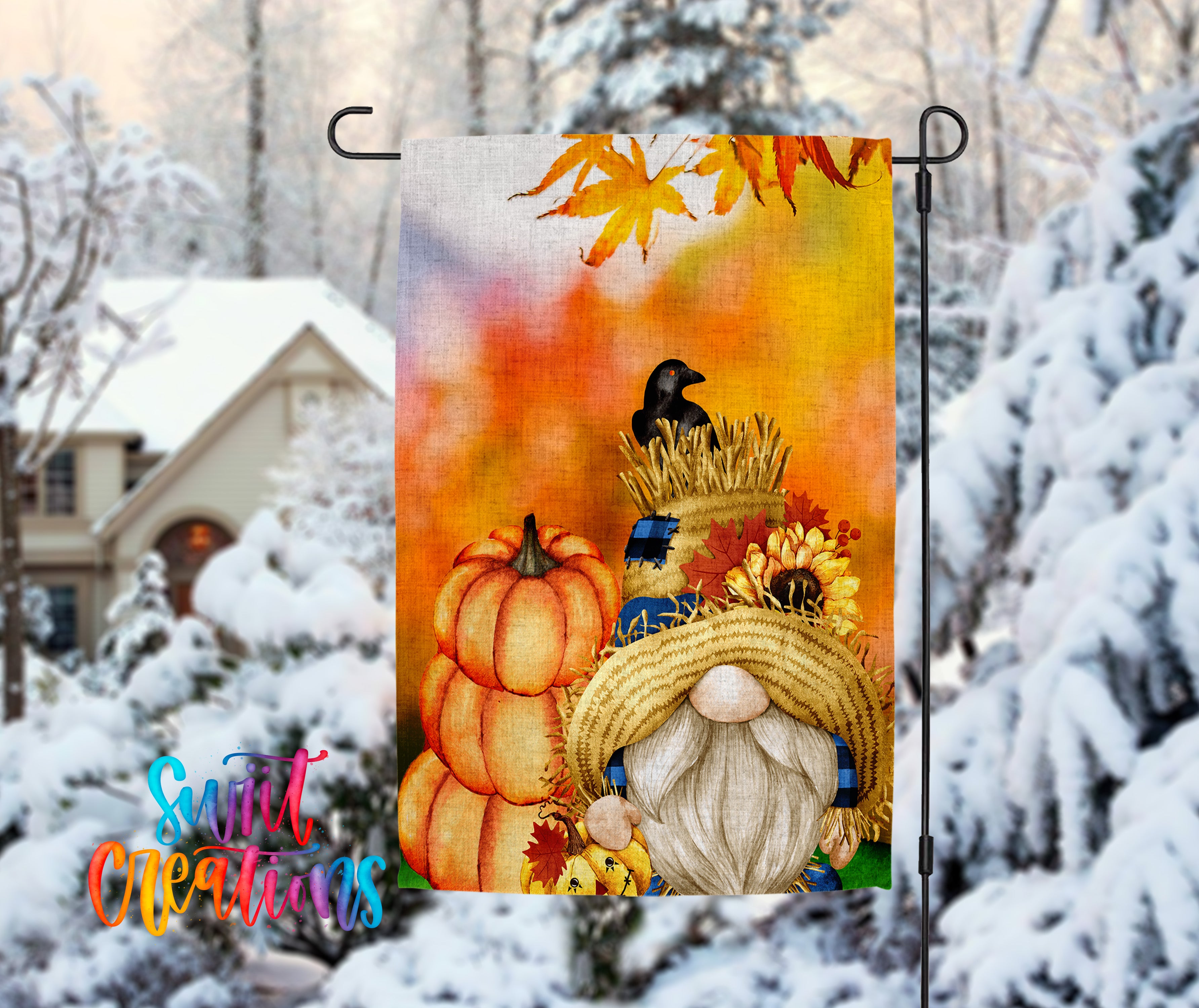 A colorful autumn-themed garden gnome is depicted in the image, surrounded by pumpkins, sunflowers, and a bird perched on a hay bale. The gnome is wearing a straw hat and has a long beard. The background features a snowy landscape with trees and a house.