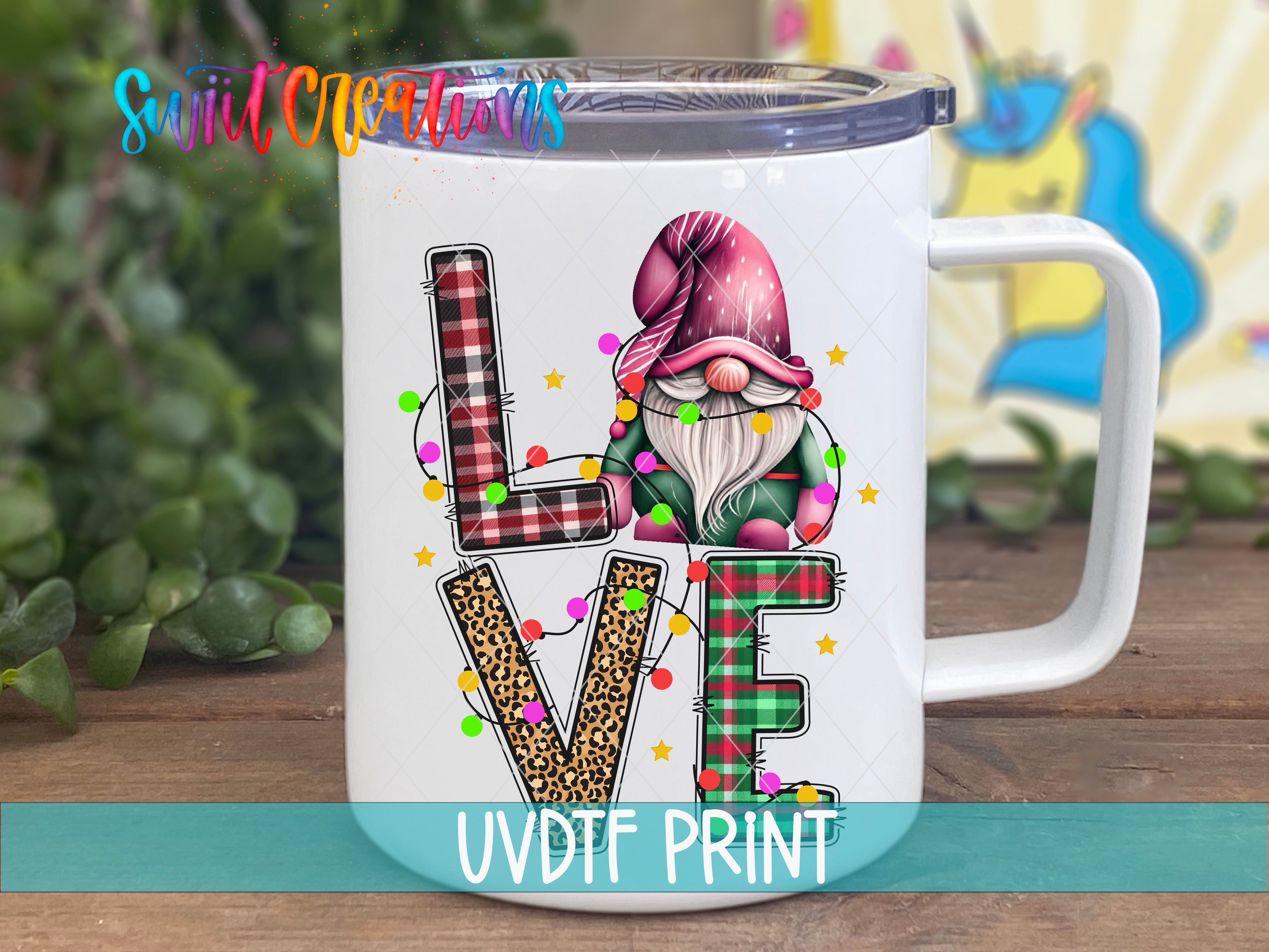 a white coffee mug with the word love painted on it