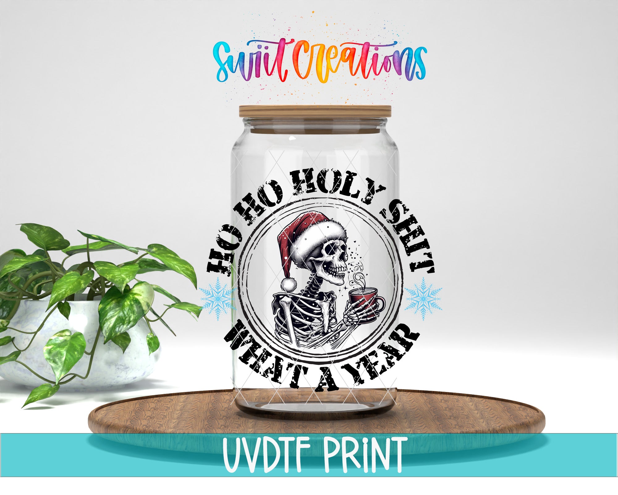 A glass jar with a skeleton wearing a Santa hat and the text "HO HO HOLY SHIT WHAT A YEAR" printed on it, placed on a wooden surface.