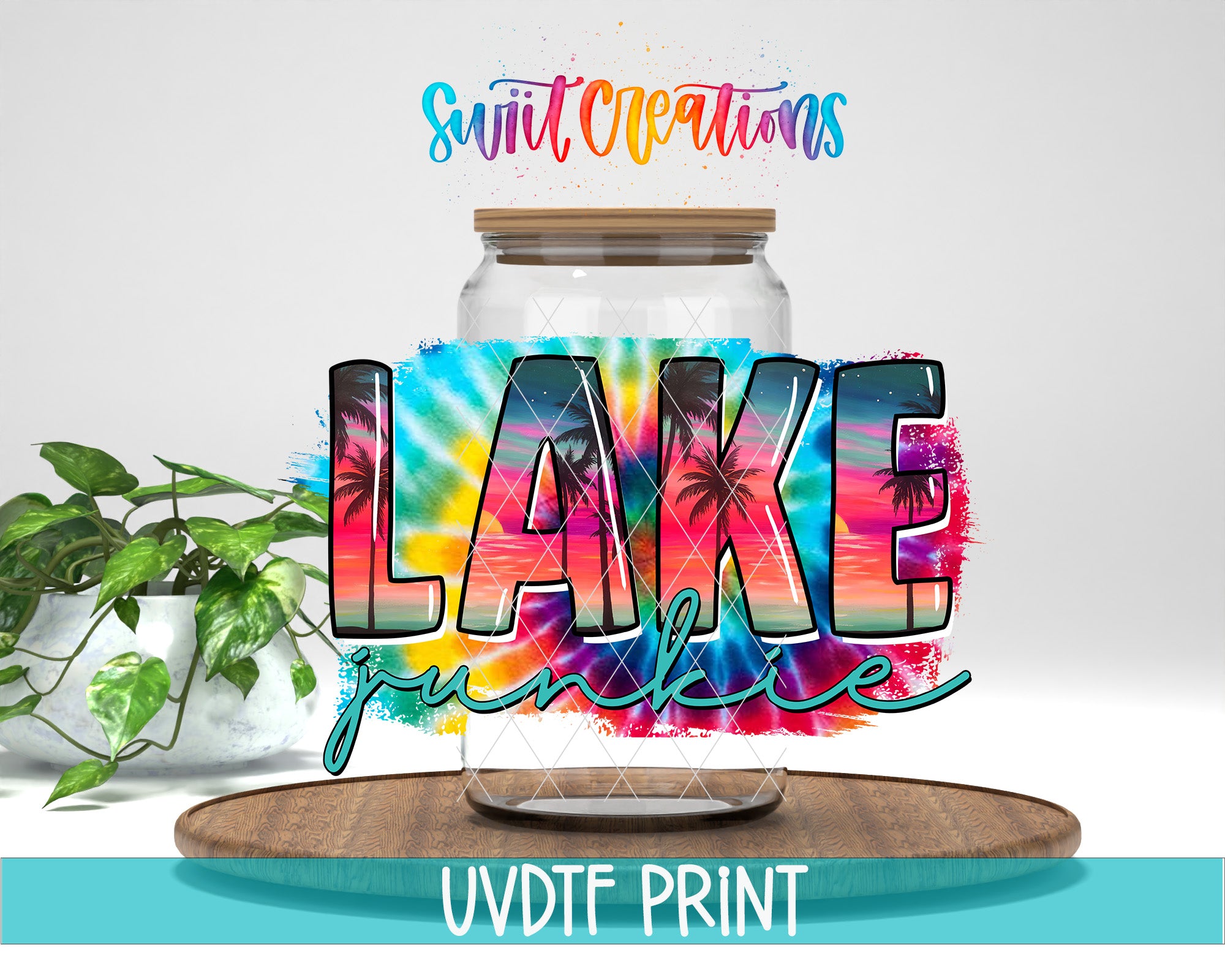 a large glass jar with a tie-dye design, surrounded by a tropical plant and a wooden tray. The text "LAKELAND" is prominently displayed in the center of the jar, and the phrase "Swift Creations" is written above it. The image is described as a collage of multiple images, and the text "UVDF PRINT" is at the bottom.