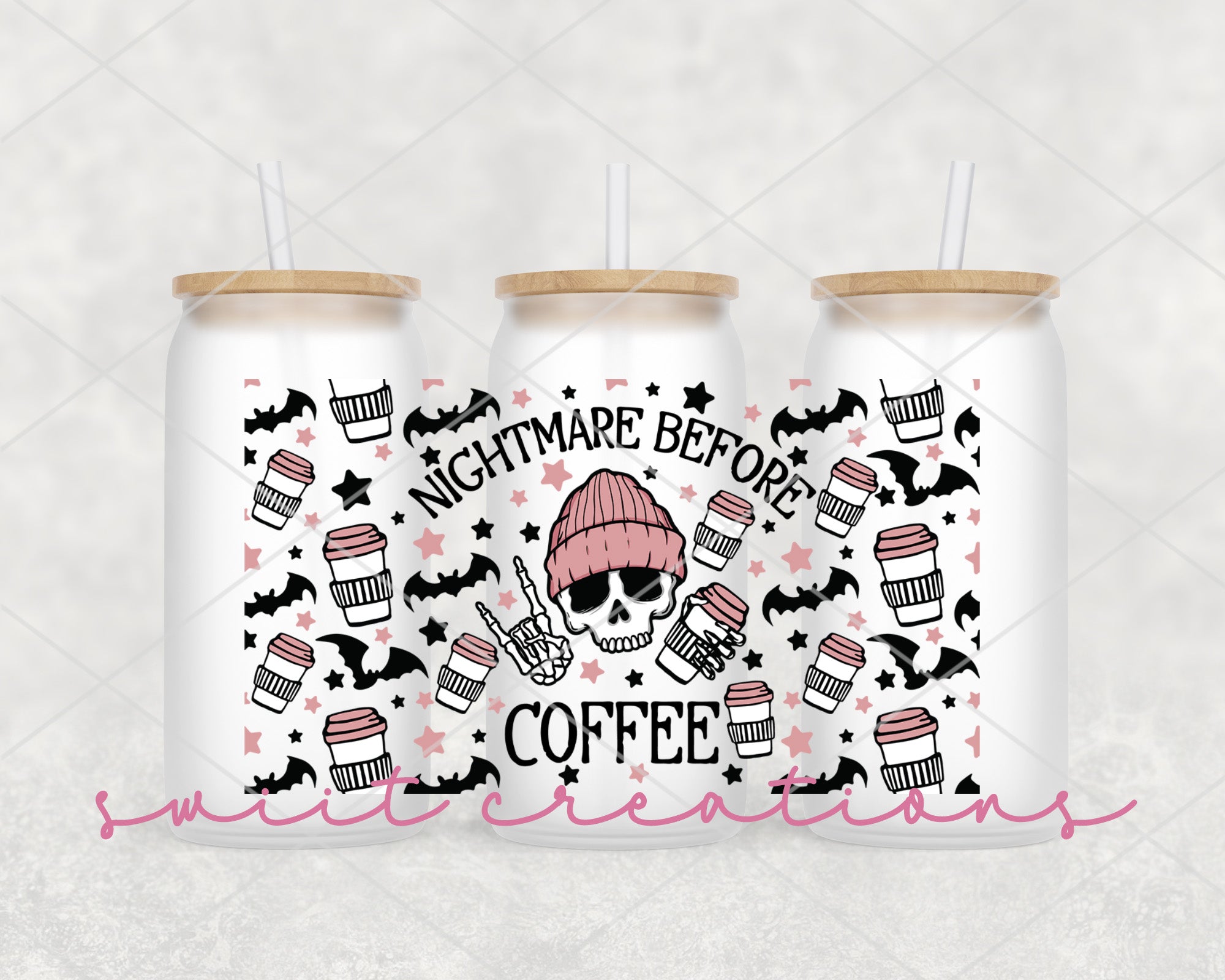 two white mason jars with pink and black designs on them