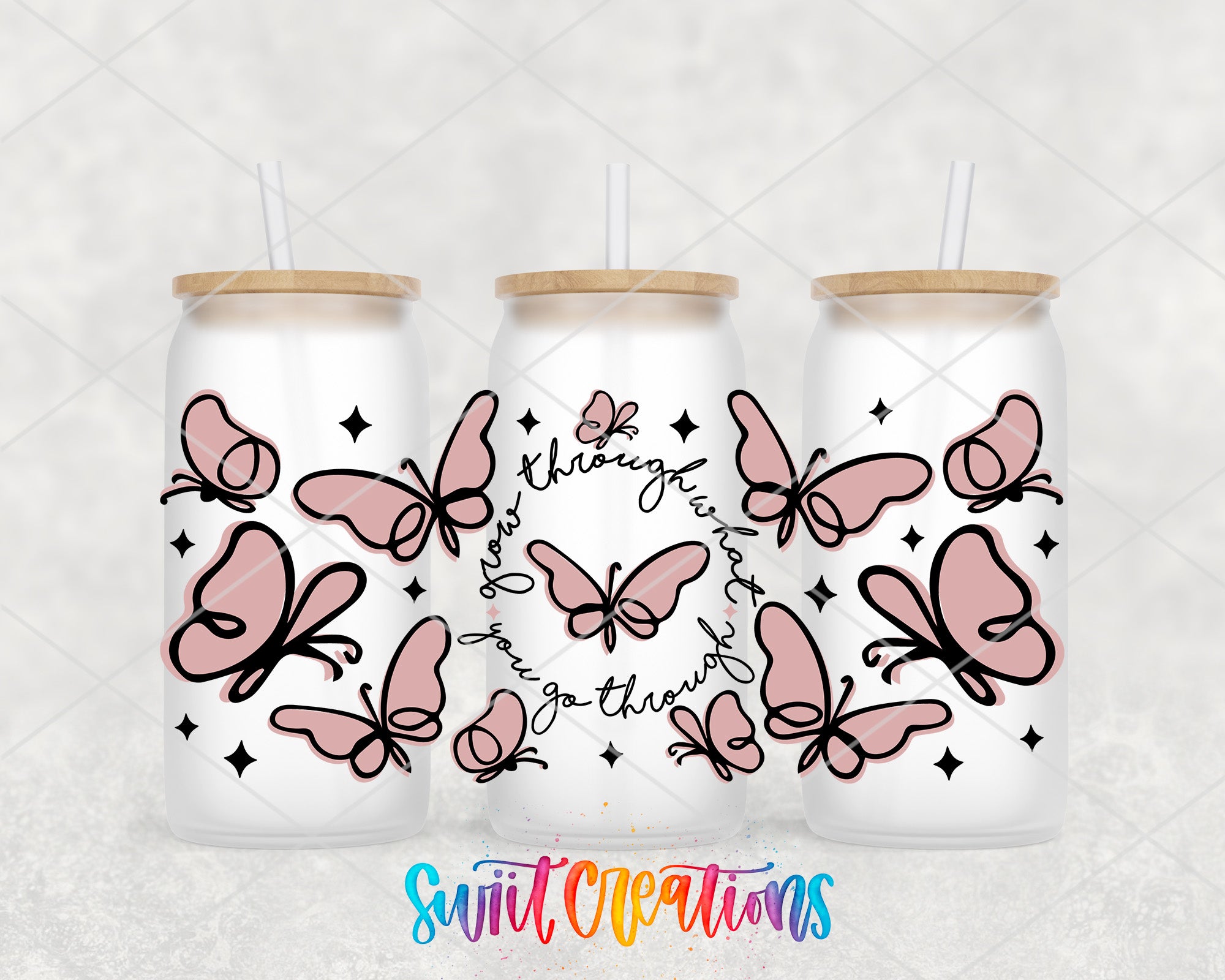 three white cans with pink butterfly designs and straws on top, arranged in a row.