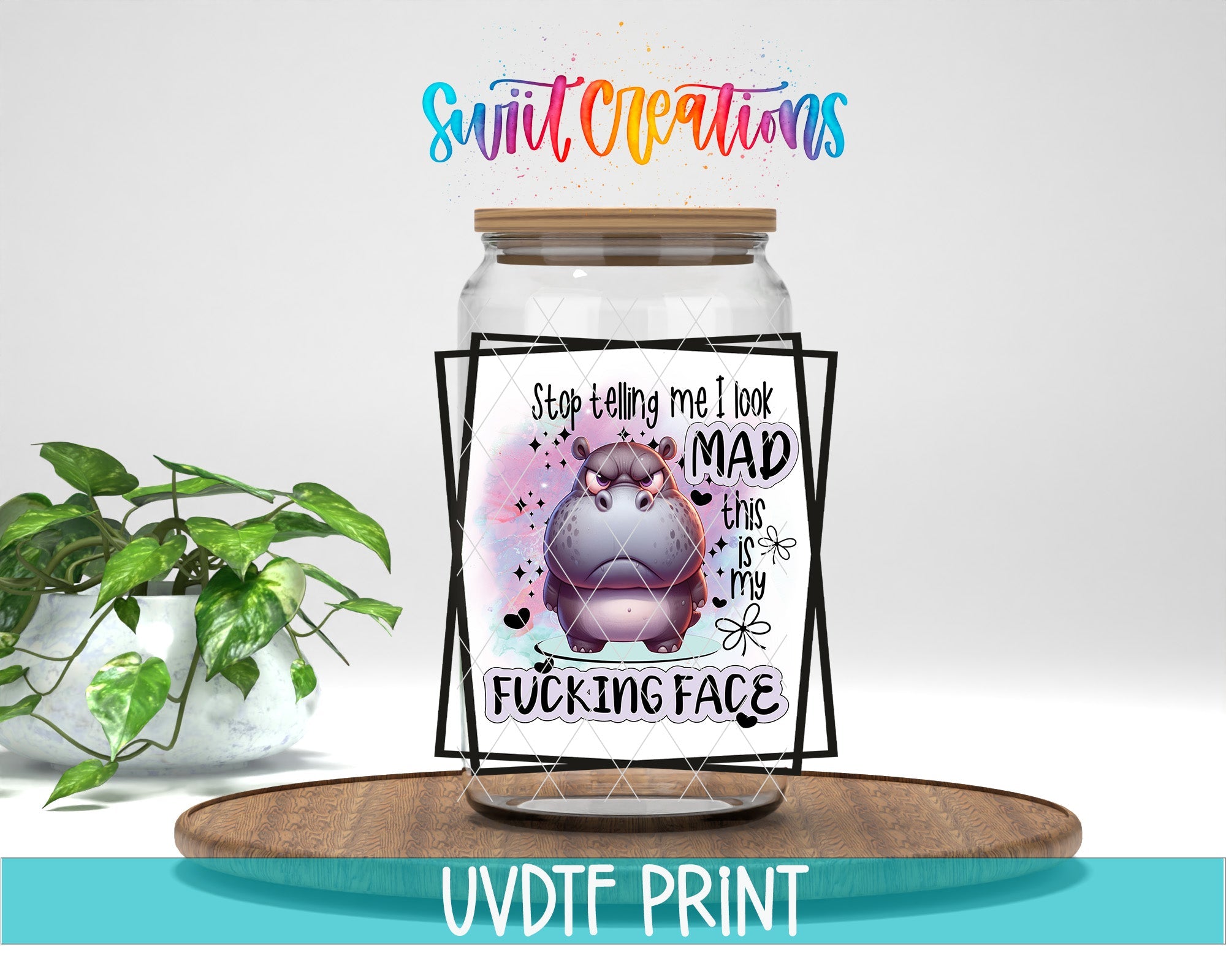 a glass jar with a picture of a hippo on it
