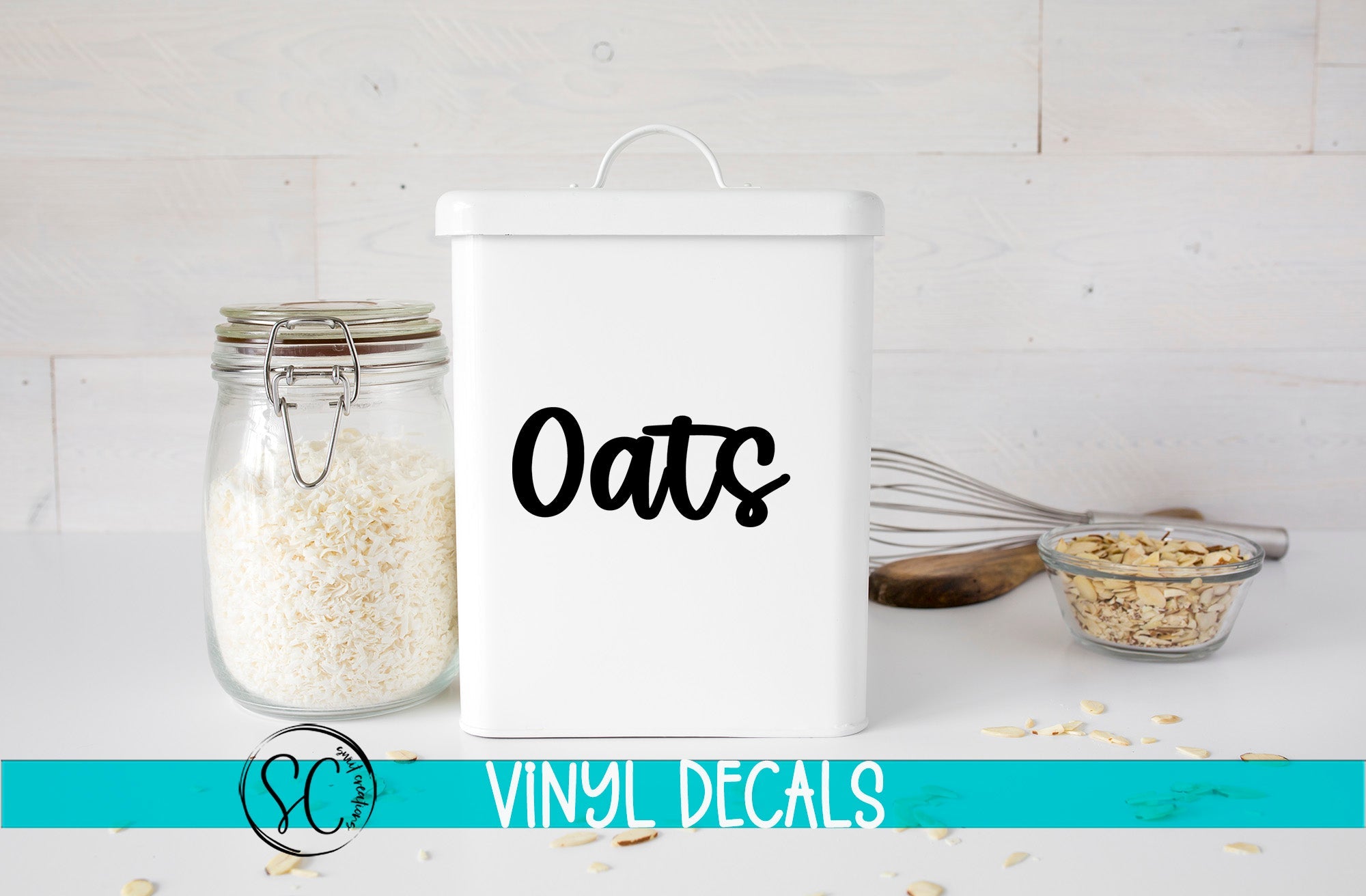 a white canister labeled "Oats" next to a glass jar filled with white grains, likely oats, and a small glass bowl containing more oats. The background is a white wooden surface with scattered oats.