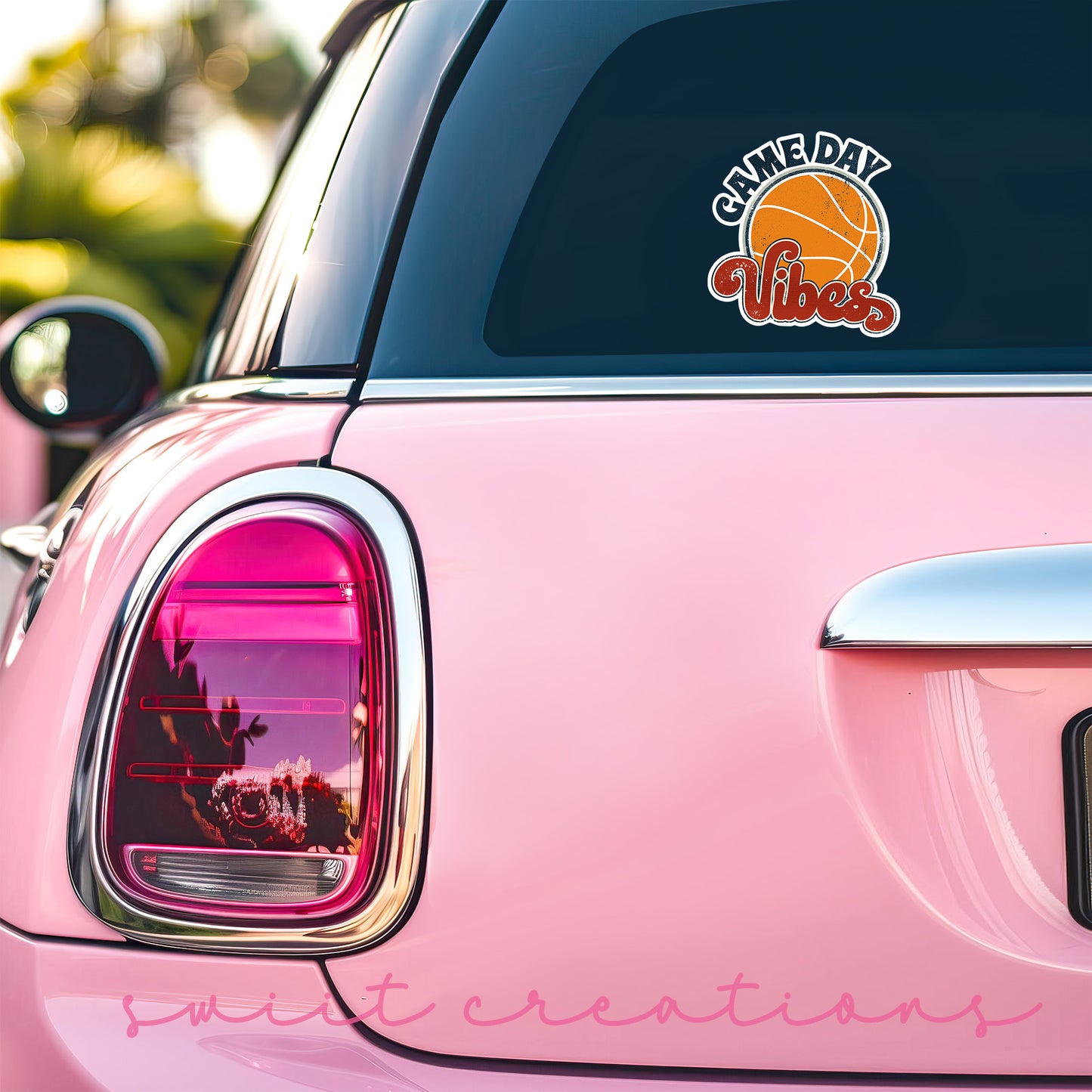 a pink car with a basketball sticker on it