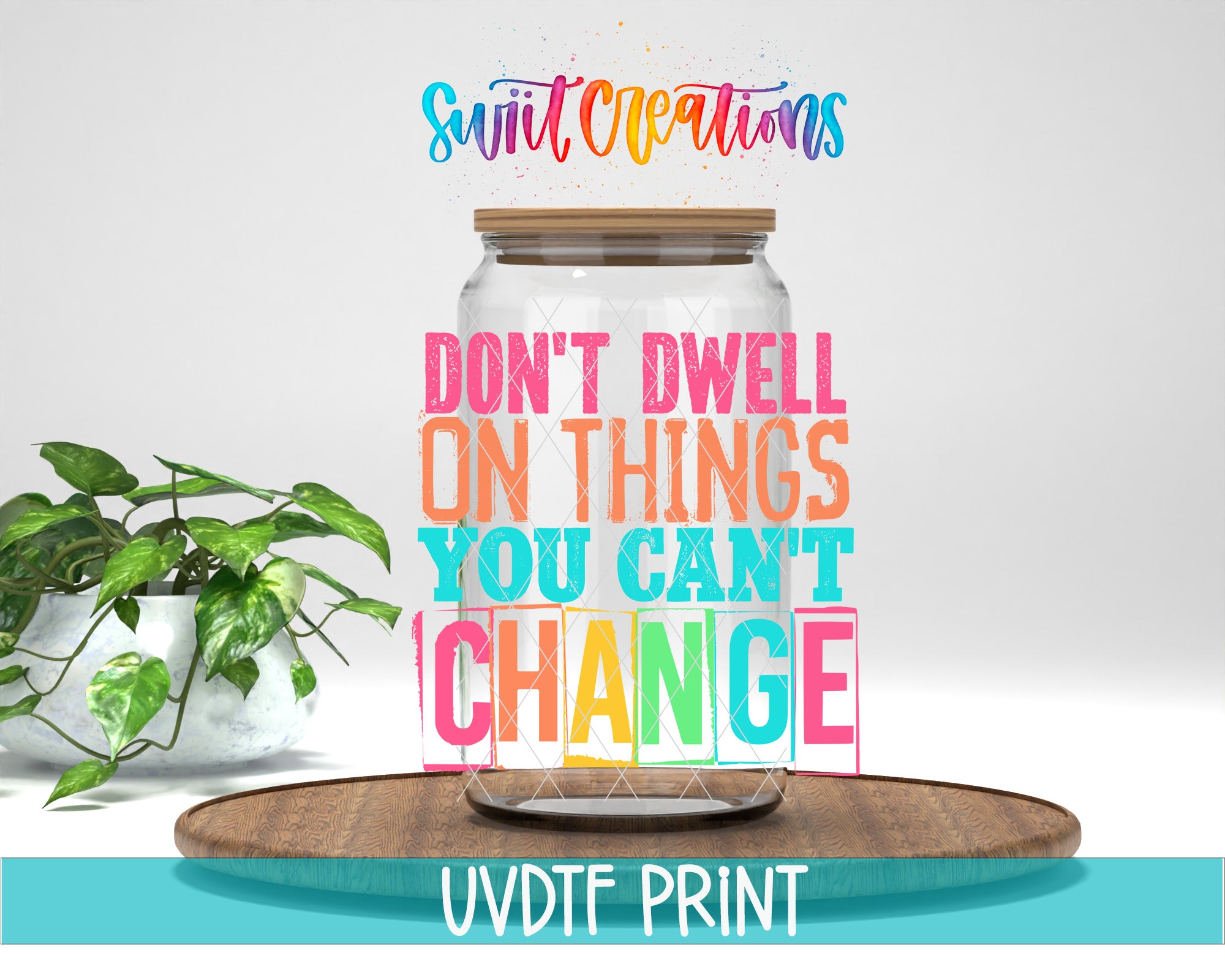 a large glass jar with a wooden lid, placed on a wooden surface. The jar is filled with colorful text that reads "DON'T DWELL ON THINGS YOU CAN'T CHANGE". In the background, there is a potted plant, and the text "Swift Creations" is written above the jar.