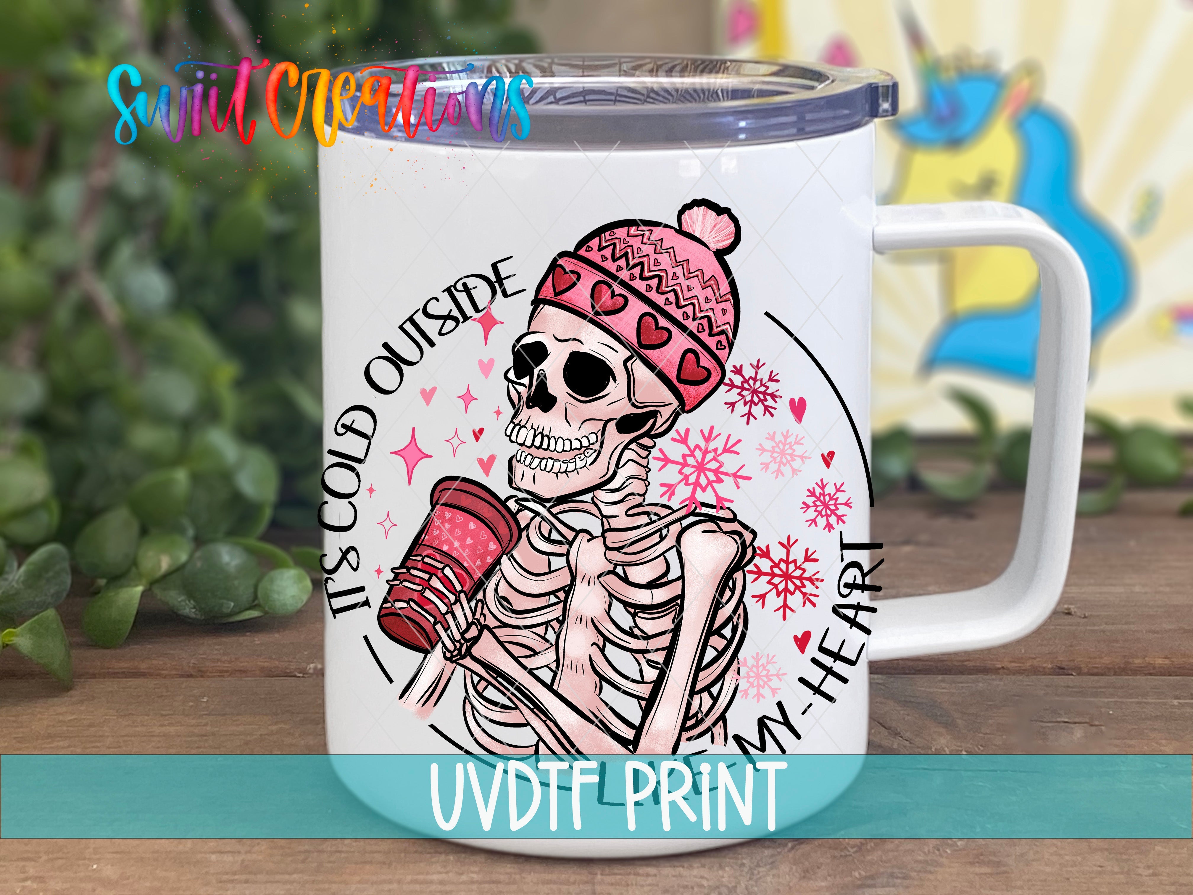 a white coffee mug with a skeleton on it