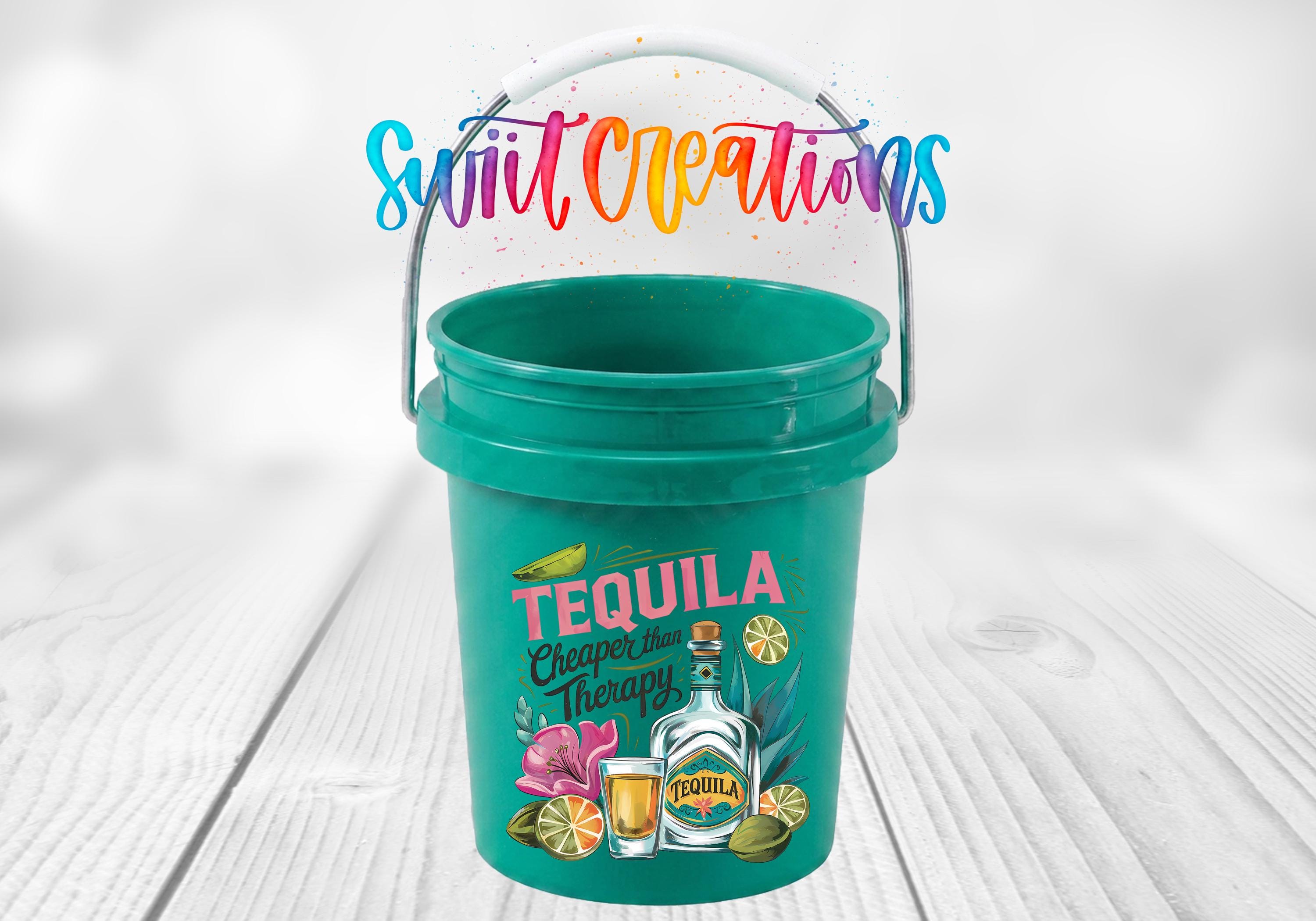 A green bucket with a tequila-themed design, featuring a bottle of tequila, a lime, and a flower, along with the text "Tequila" and "Chaser Therapy".