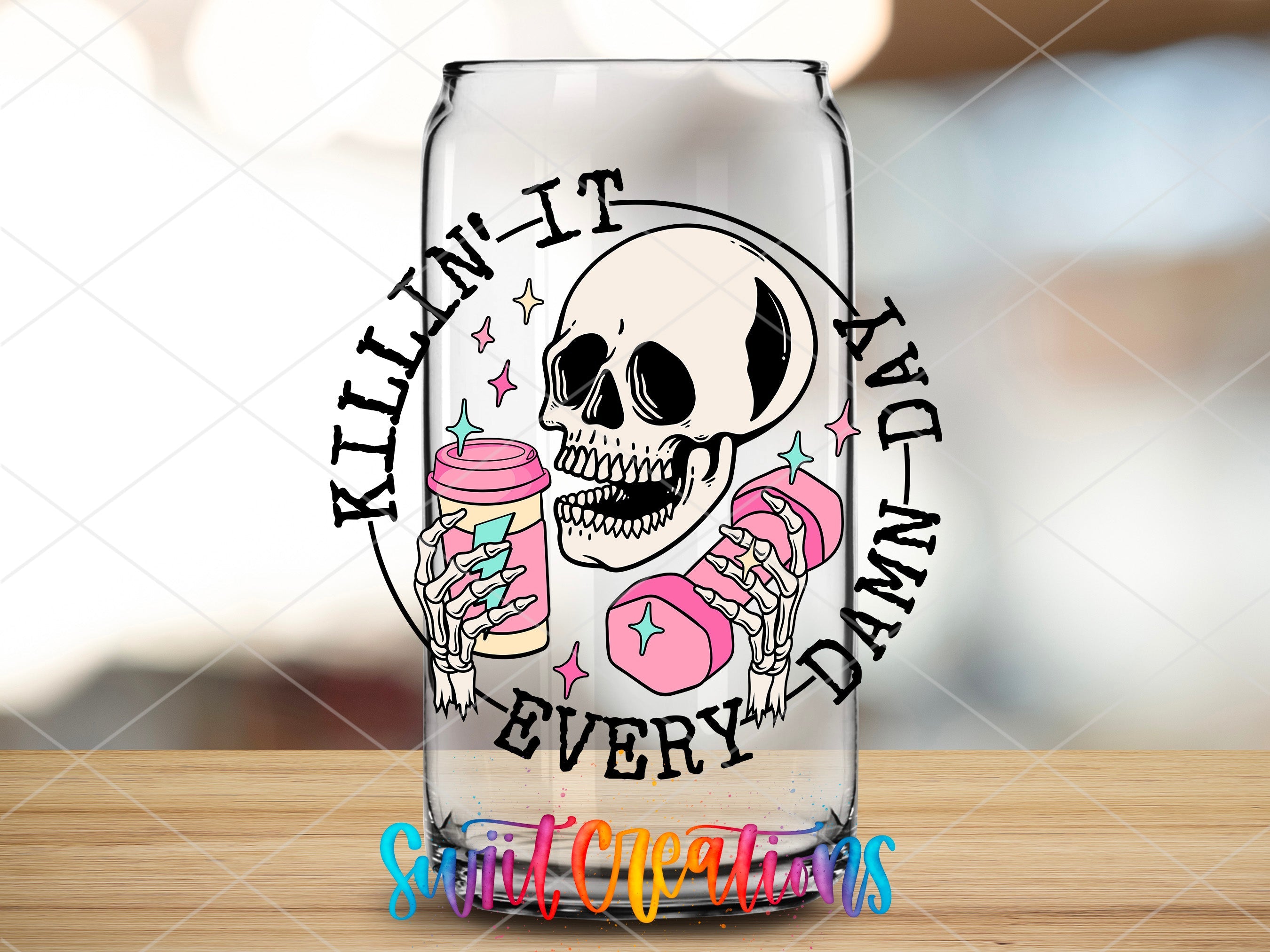 a glass with a skull and donuts on it