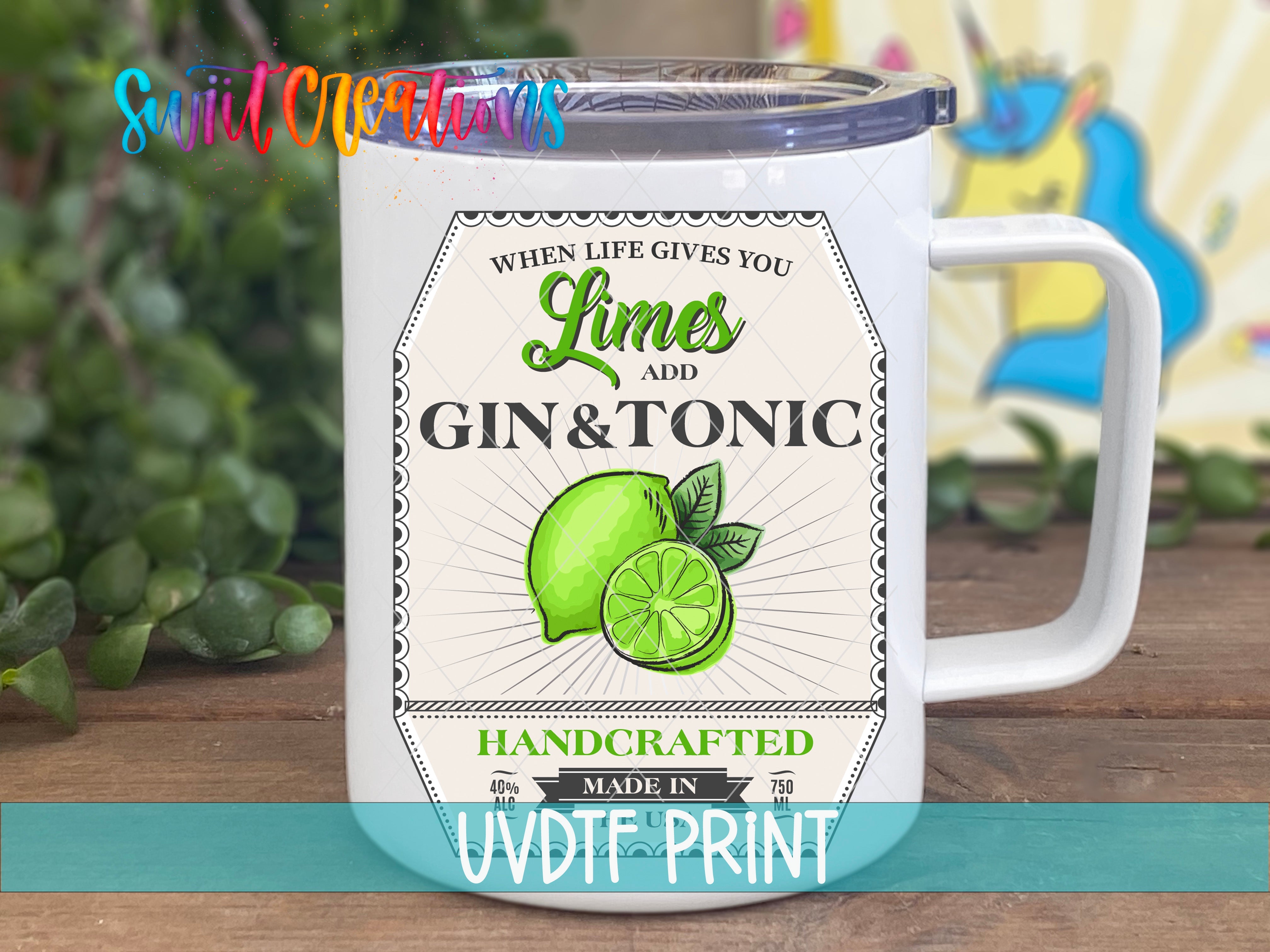 a white coffee mug with limes and gin and tonic on it