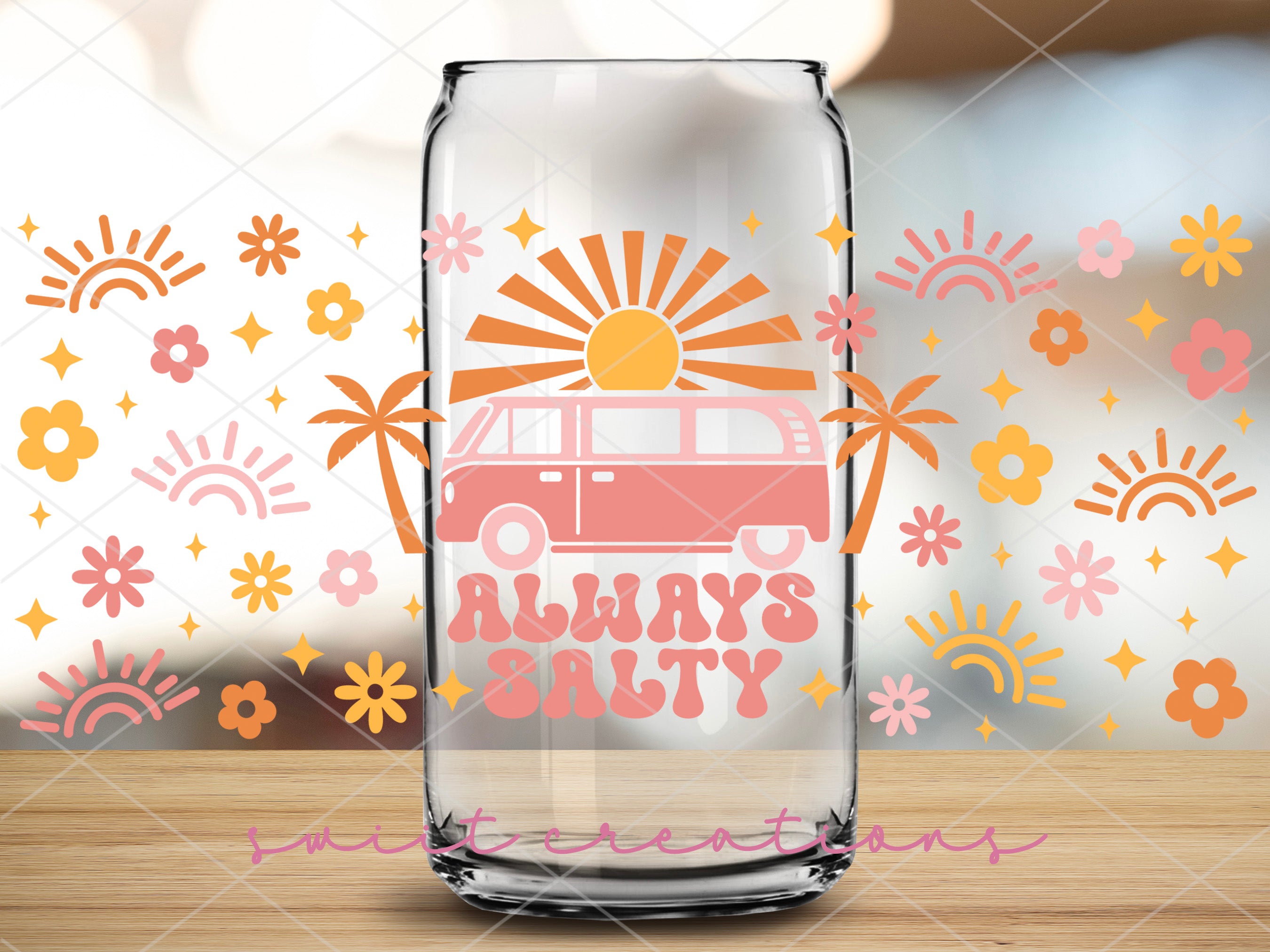 a glass vase with a pink van on it