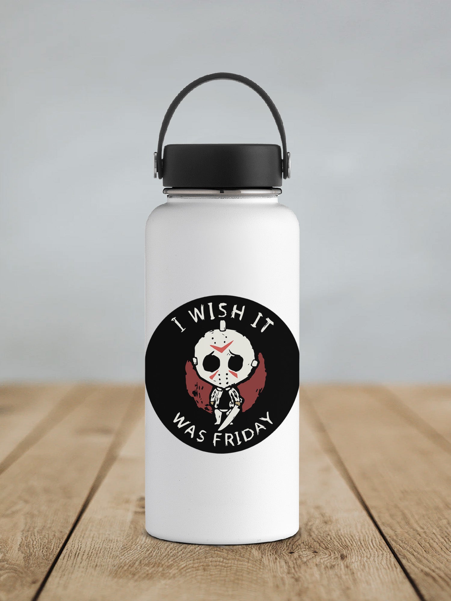a white water bottle sitting on top of a wooden table