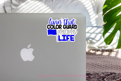 Livin' That Color Guard Mom Life sticker on the lid of a silver laptop