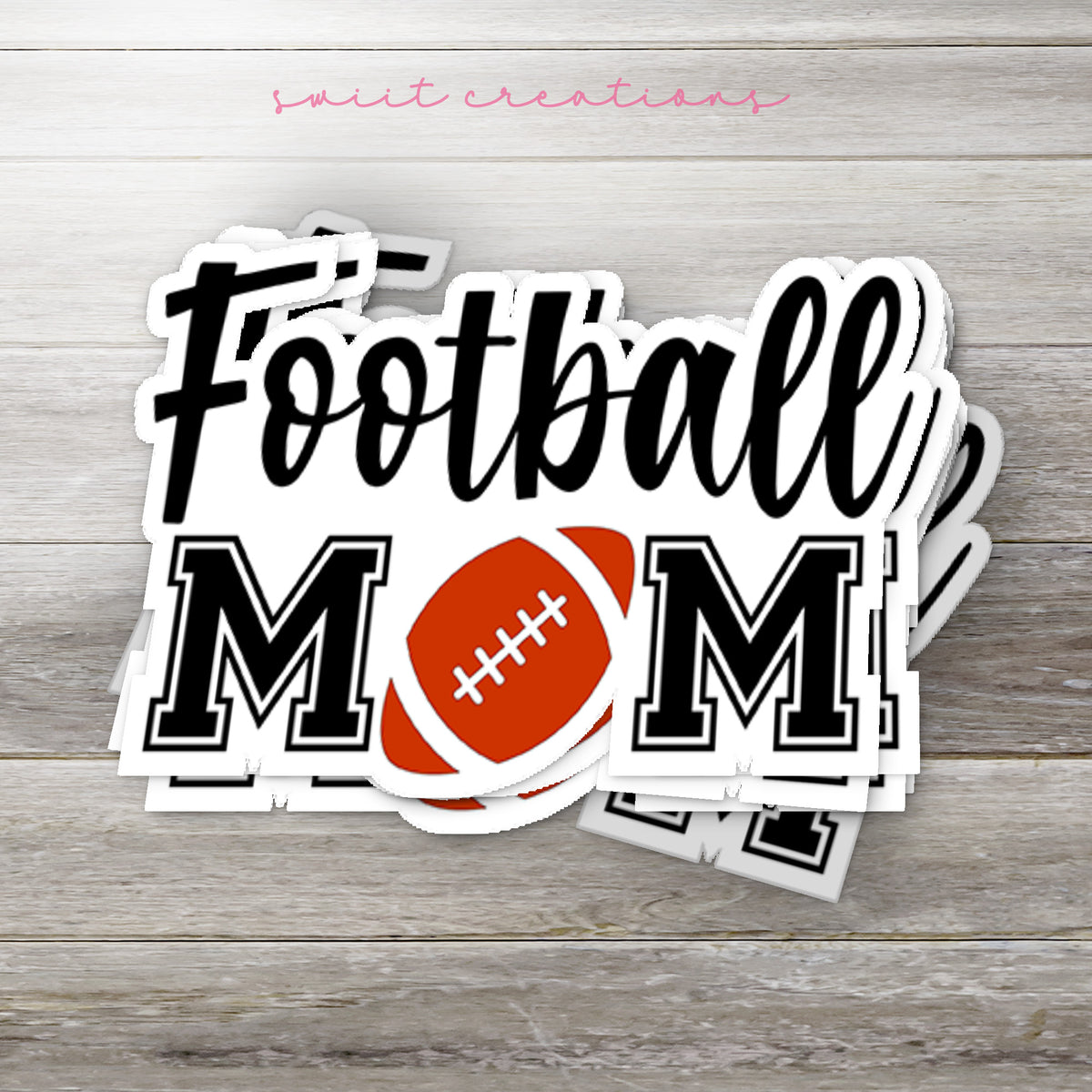 Stack of Football Mom glossy stickers on a gray wood table