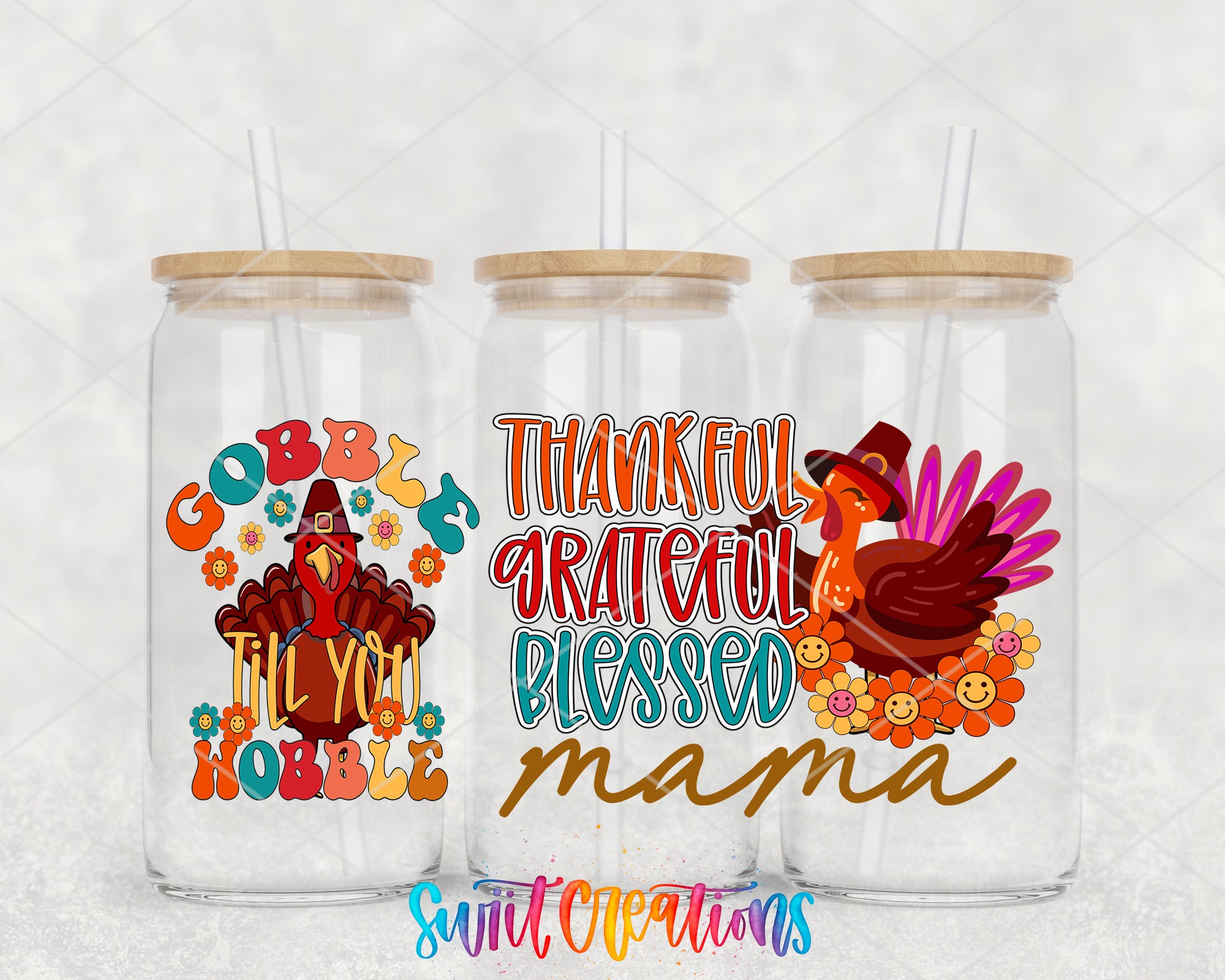 three glass tumblers with Thanksgiving-themed designs. The tumblers have wooden lids and straws. The designs include a turkey, flowers, and text that says "Thankful Gratful Blessed Mama".