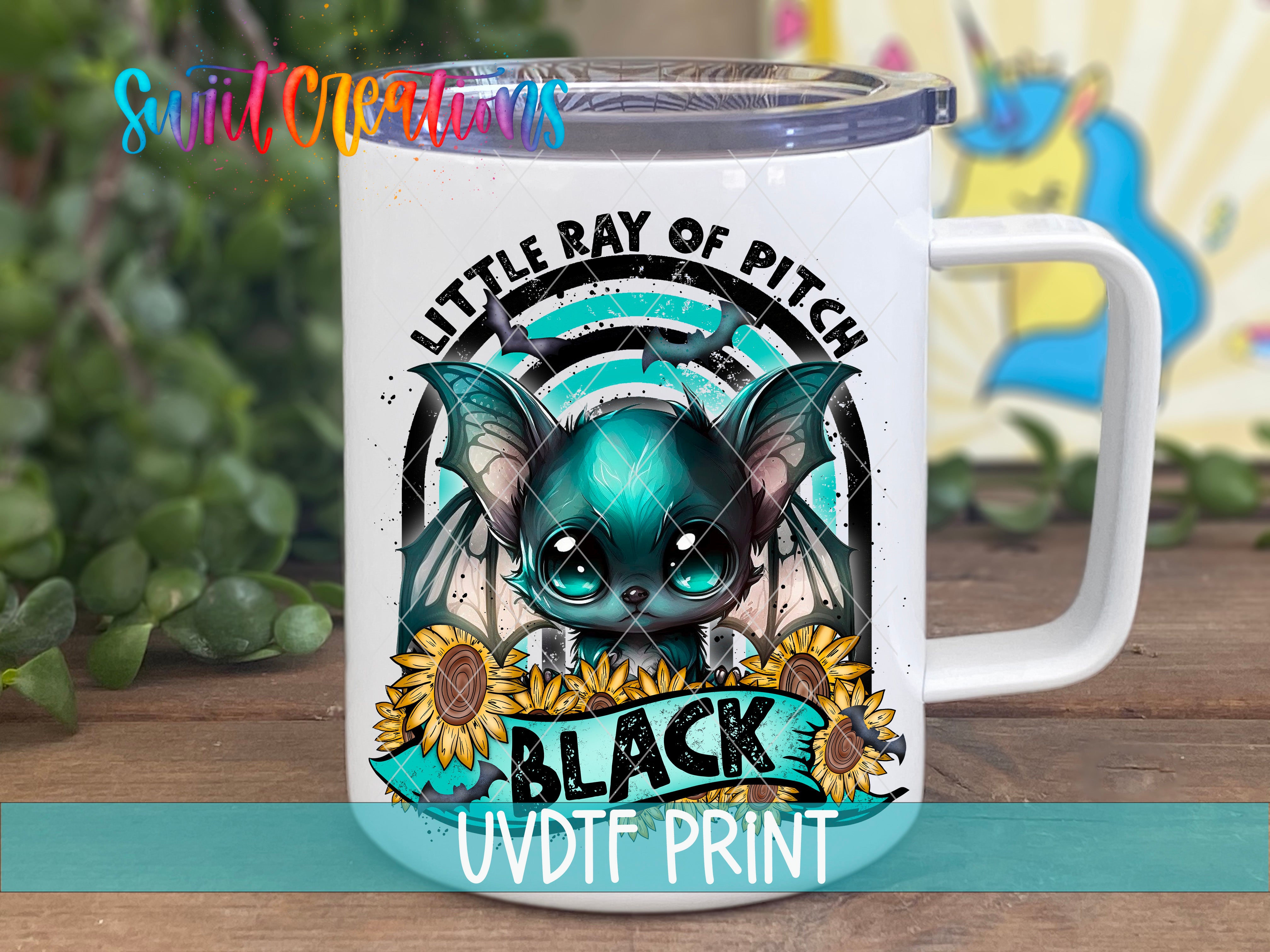 A white mug with a colorful design featuring a bat-like creature, sunflowers, and the text "Little Ray of Pitch" and "Black UVDF Print".