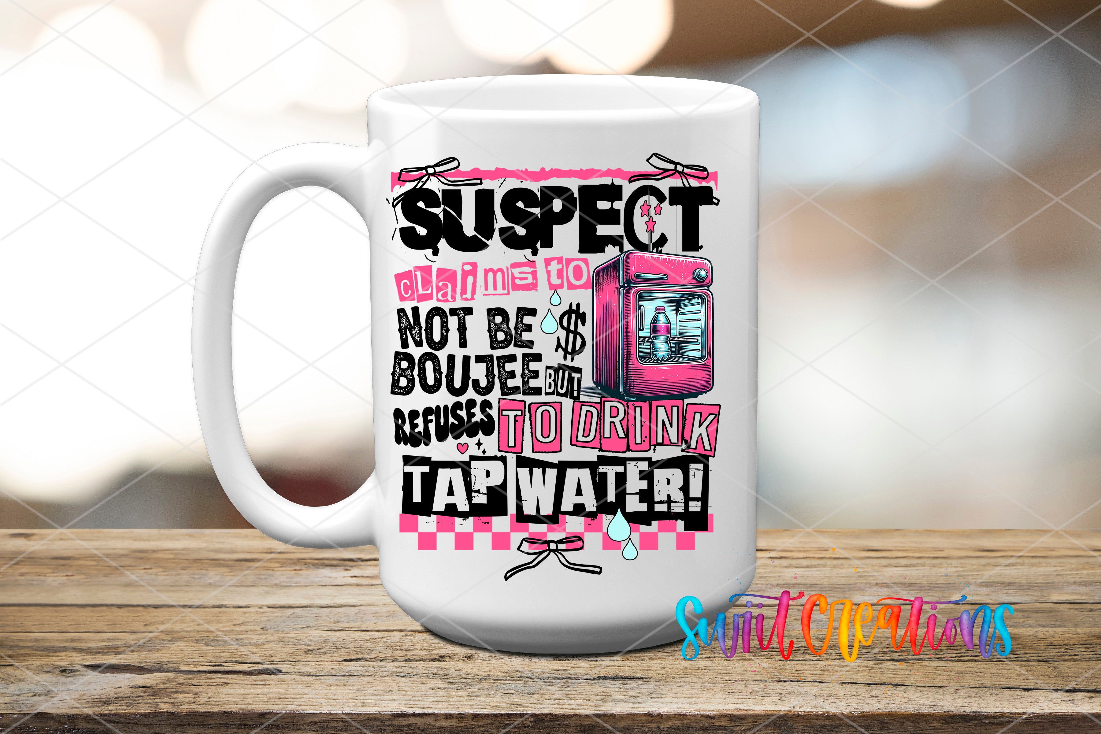 A white mug with a colorful design featuring text and an illustration of a pink and black appliance.