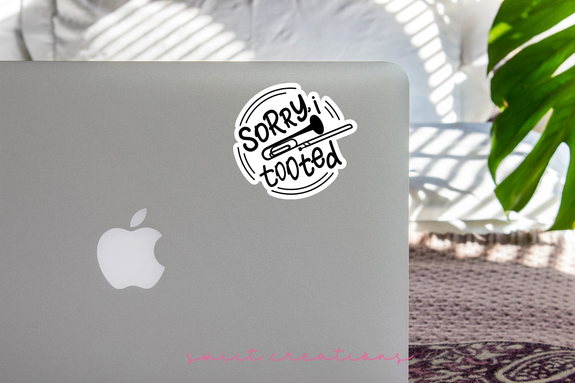 a laptop with a sticker on it sitting on a table
