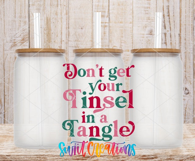 two tumblers with the words, don't get your tinsel in a