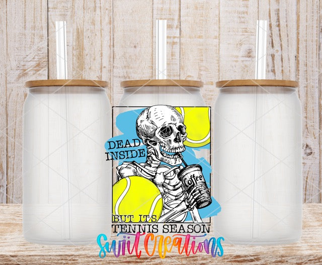 two white coffee mugs with a skeleton holding a tennis ball