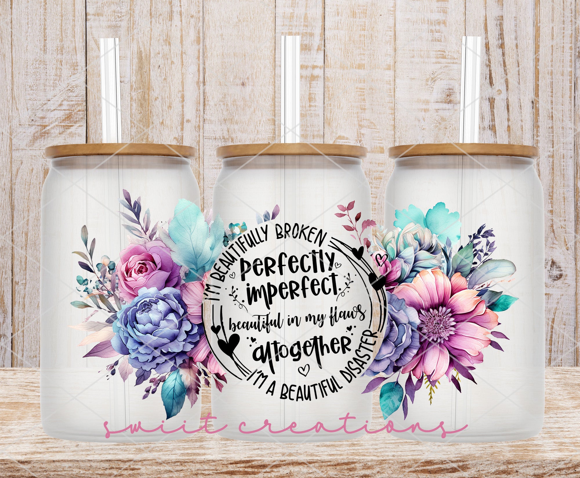 two white coffee mugs with floral designs on them
