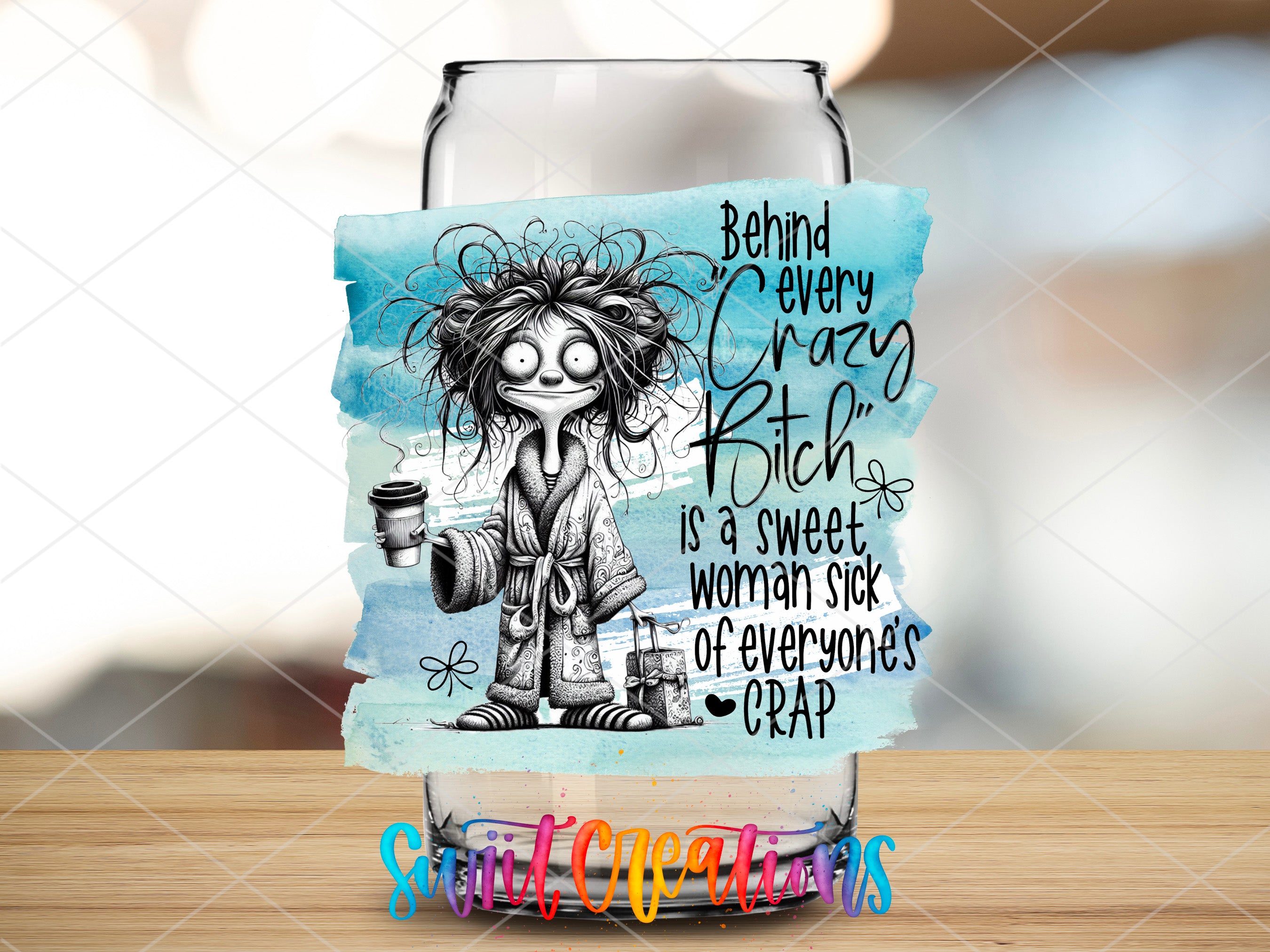 a glass with a picture of a woman holding a cup