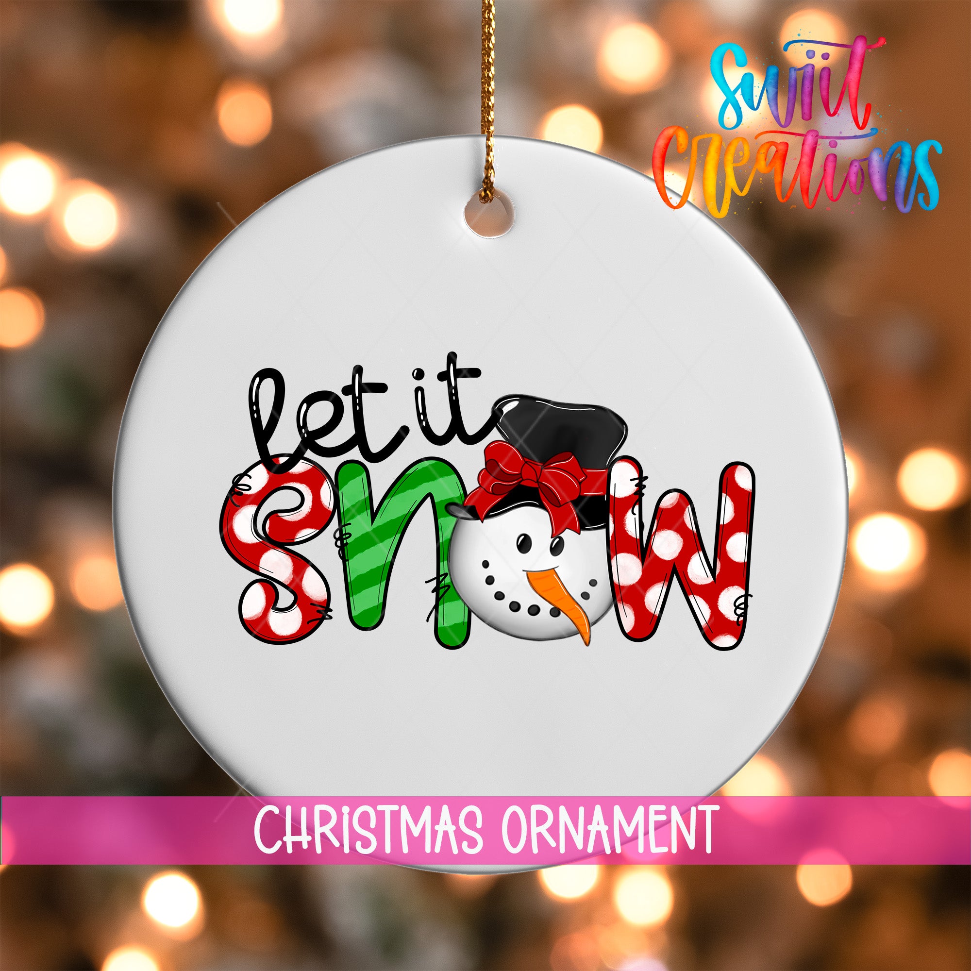 A white Christmas ornament with the text "let it snow" and a snowman graphic.