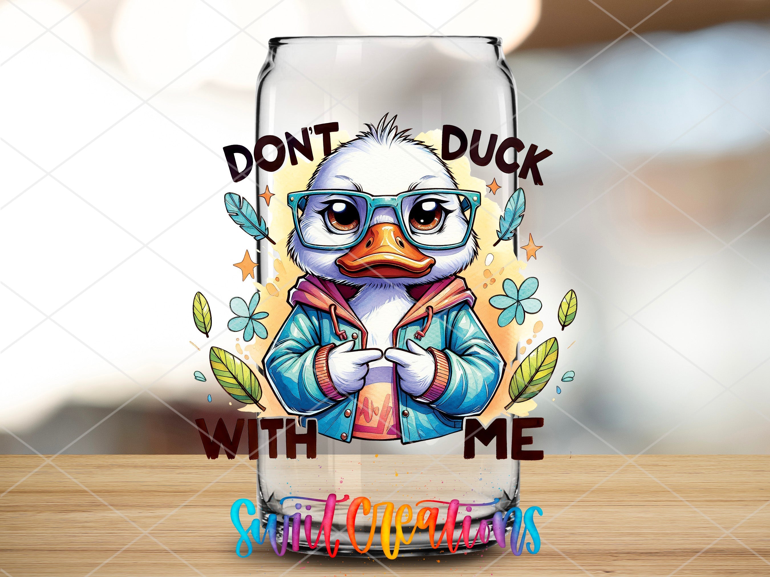 a glass with a picture of a duck wearing glasses