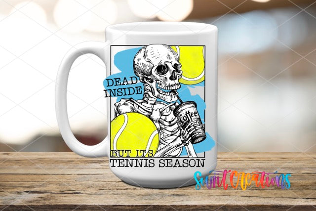 a coffee mug with a skeleton holding a tennis ball