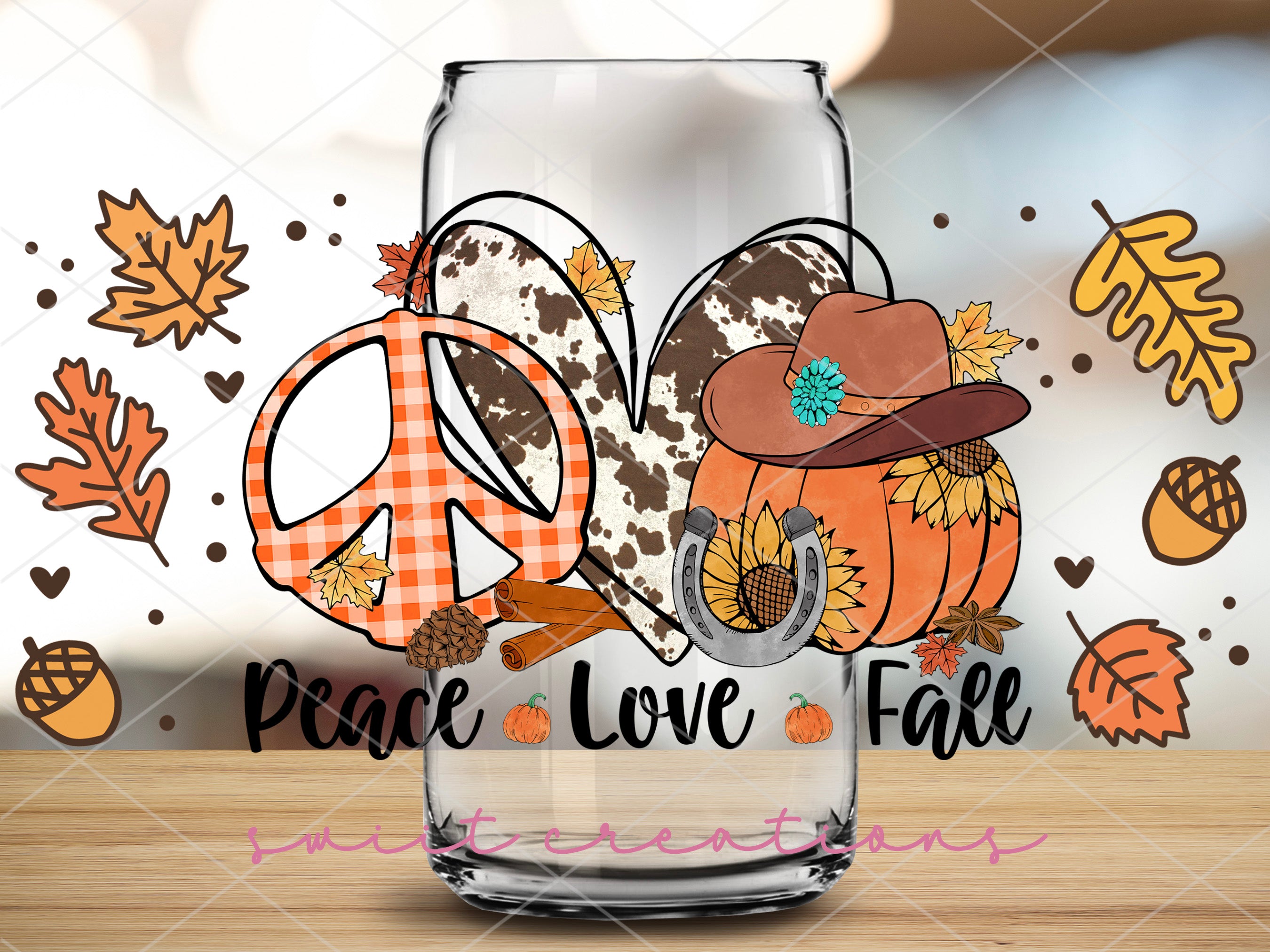 a glass with a peace love fall design on it