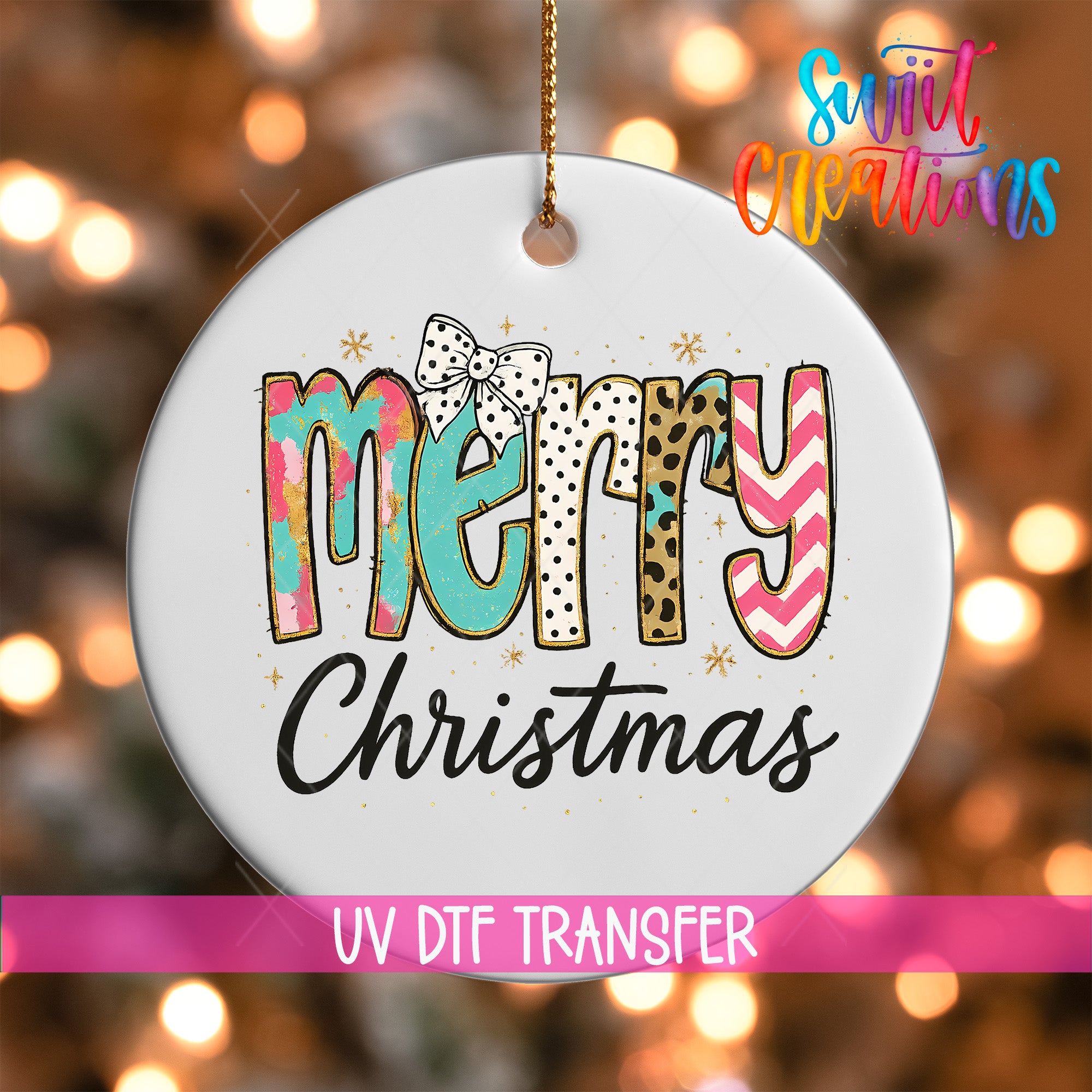 A white ornament with the text "MERRY CHRISTMAS" in a colorful, stylized font.