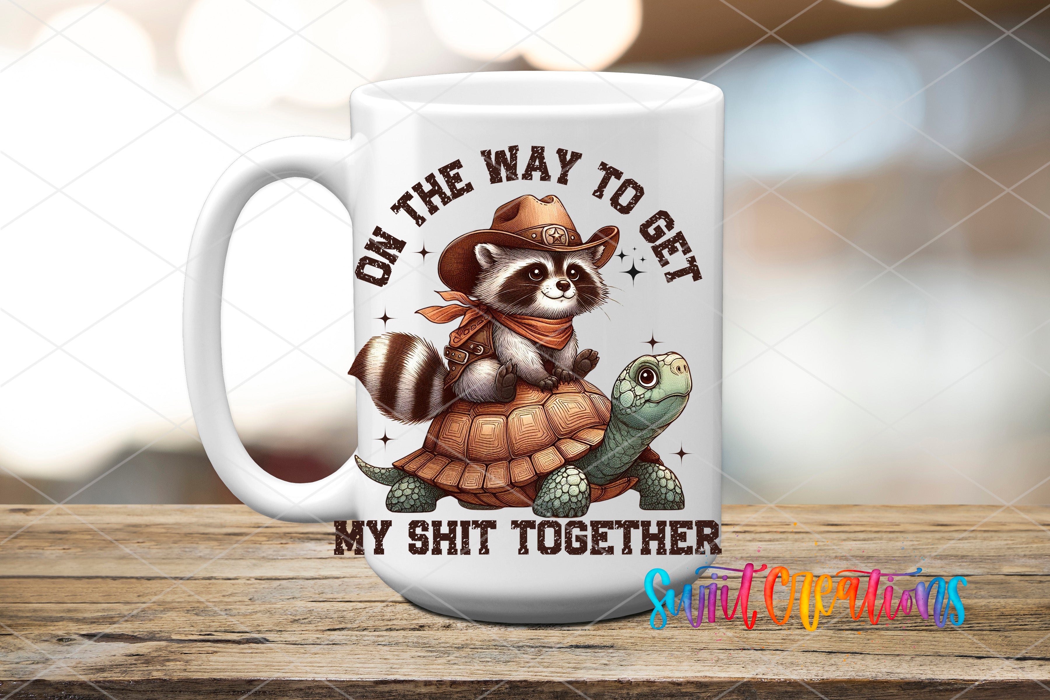 a coffee mug with a raccoon riding on top of it