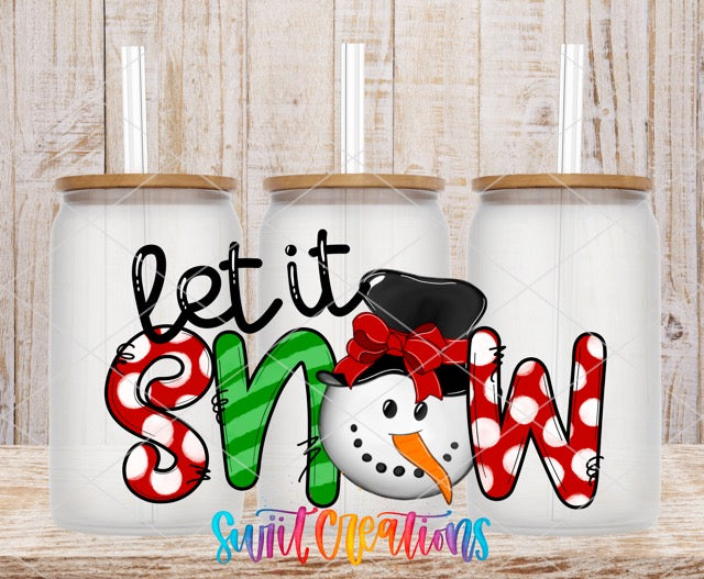 two coffee mugs with the words let it snow and a snowman wearing a