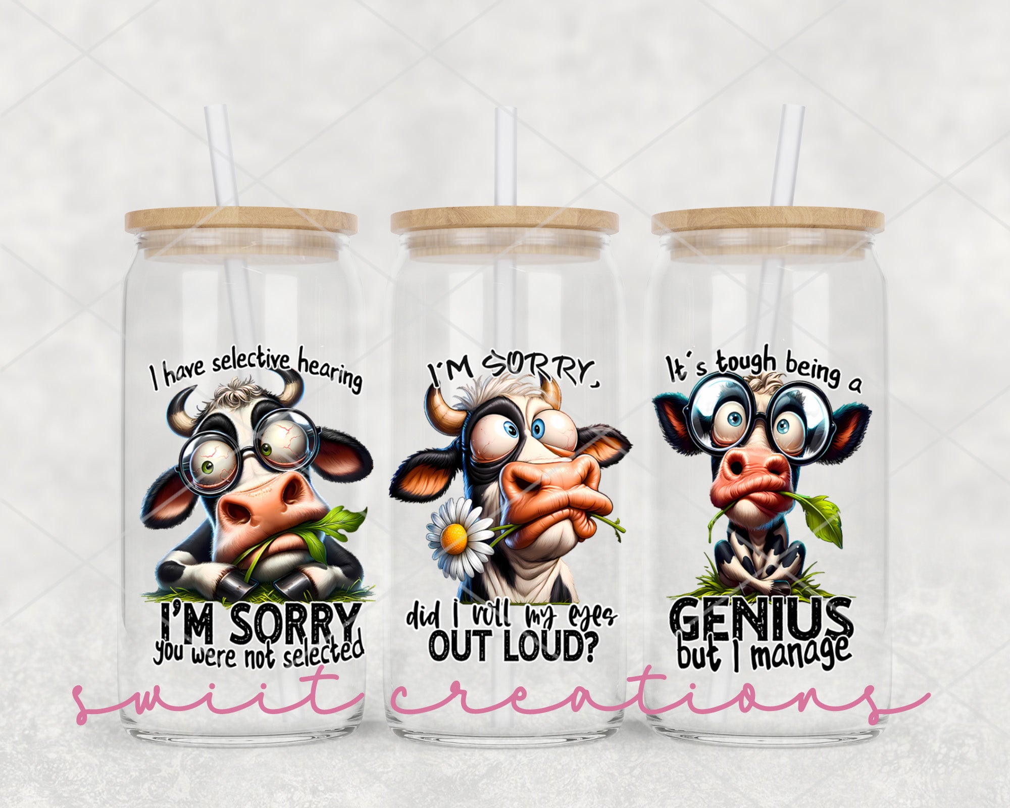 a set of three tumblers with cartoon cows on them