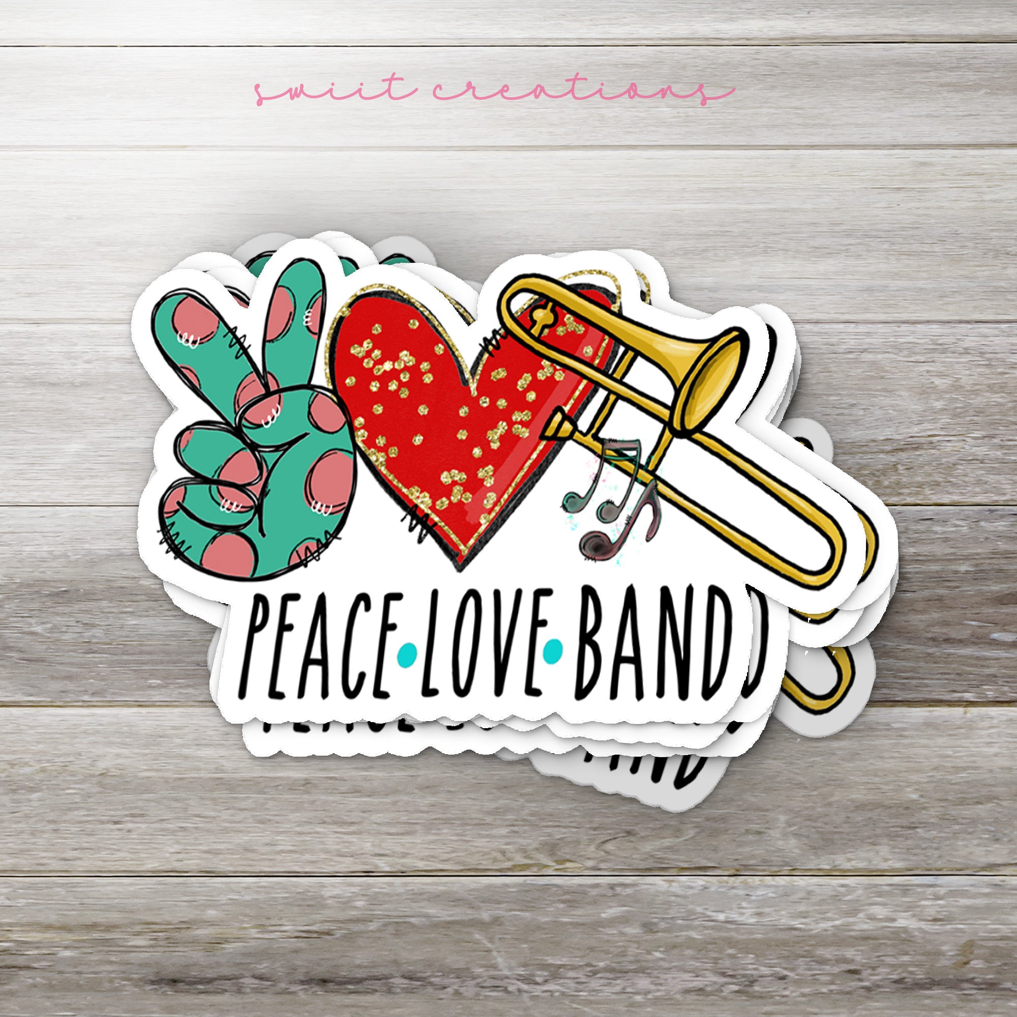 a peace love band sticker on a wooden background