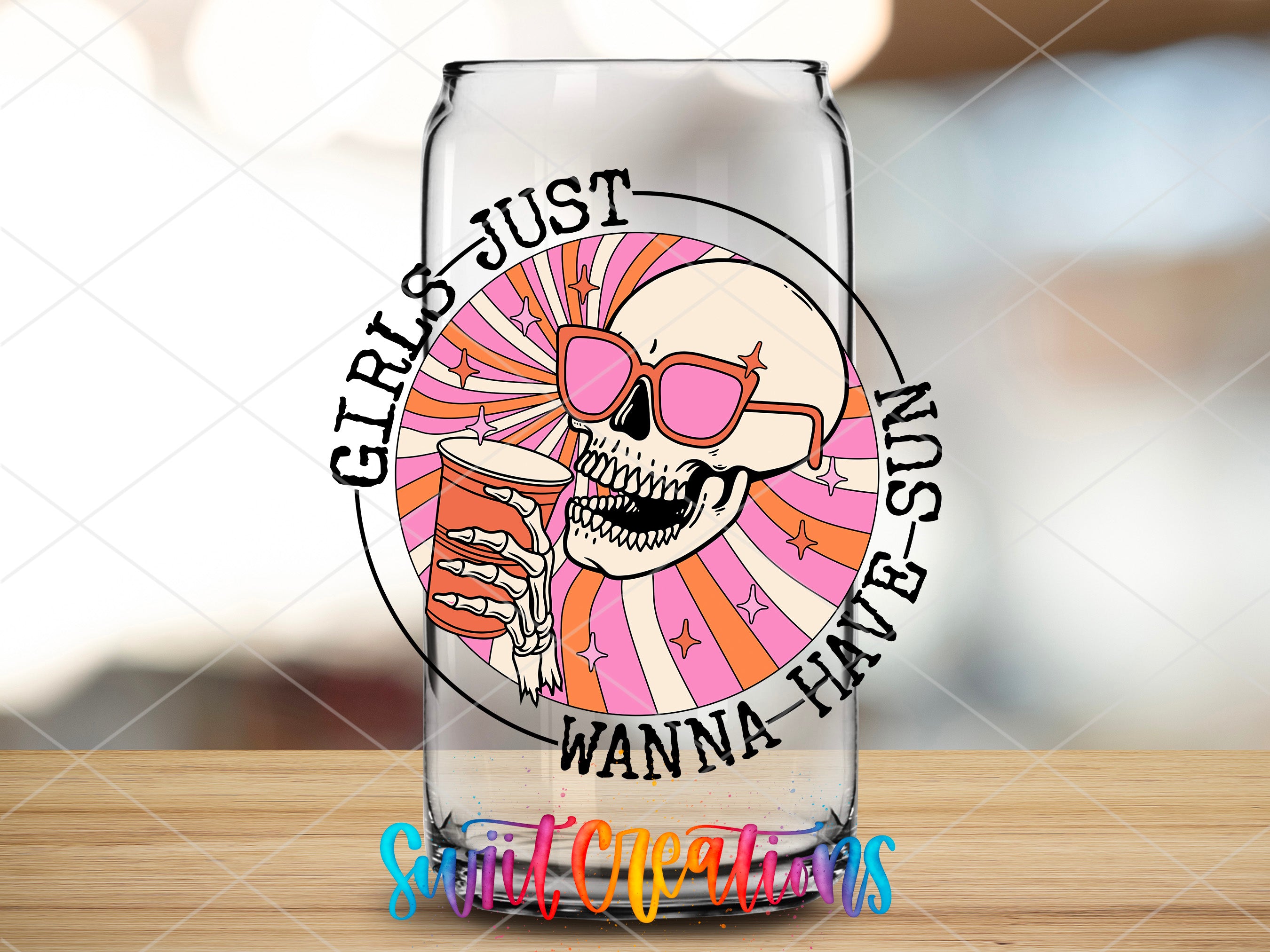a glass with a picture of a skull wearing sunglasses