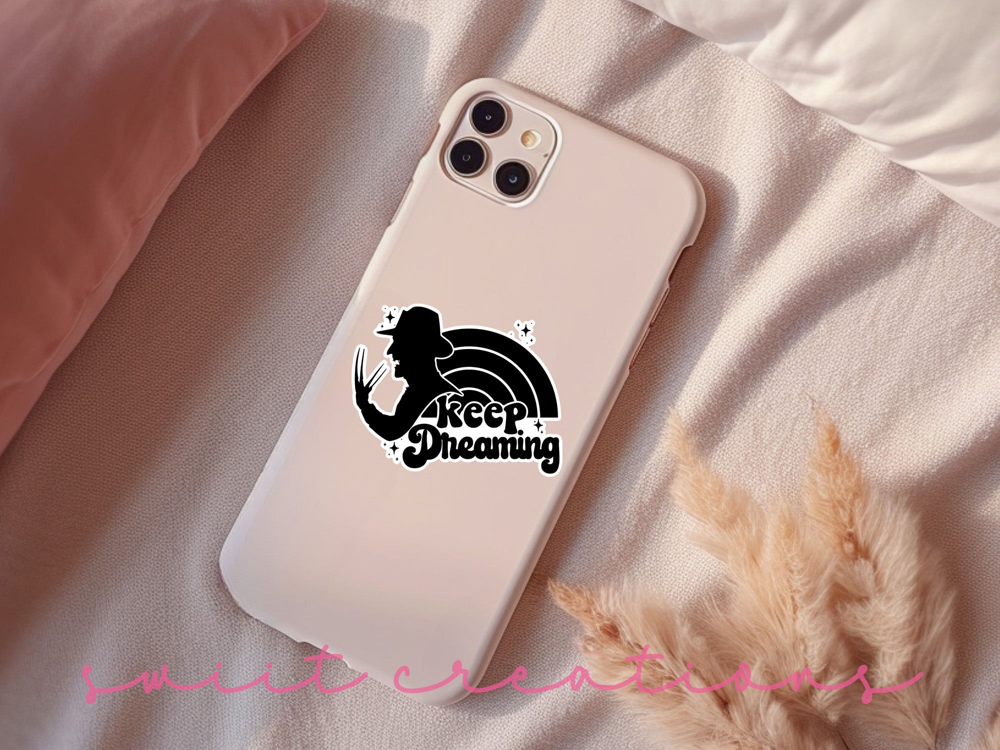a phone case sitting on top of a bed