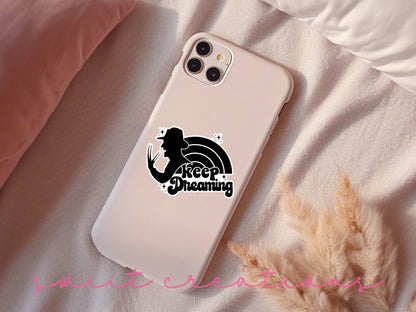 Keep Dreaming sticker on a pink phone case