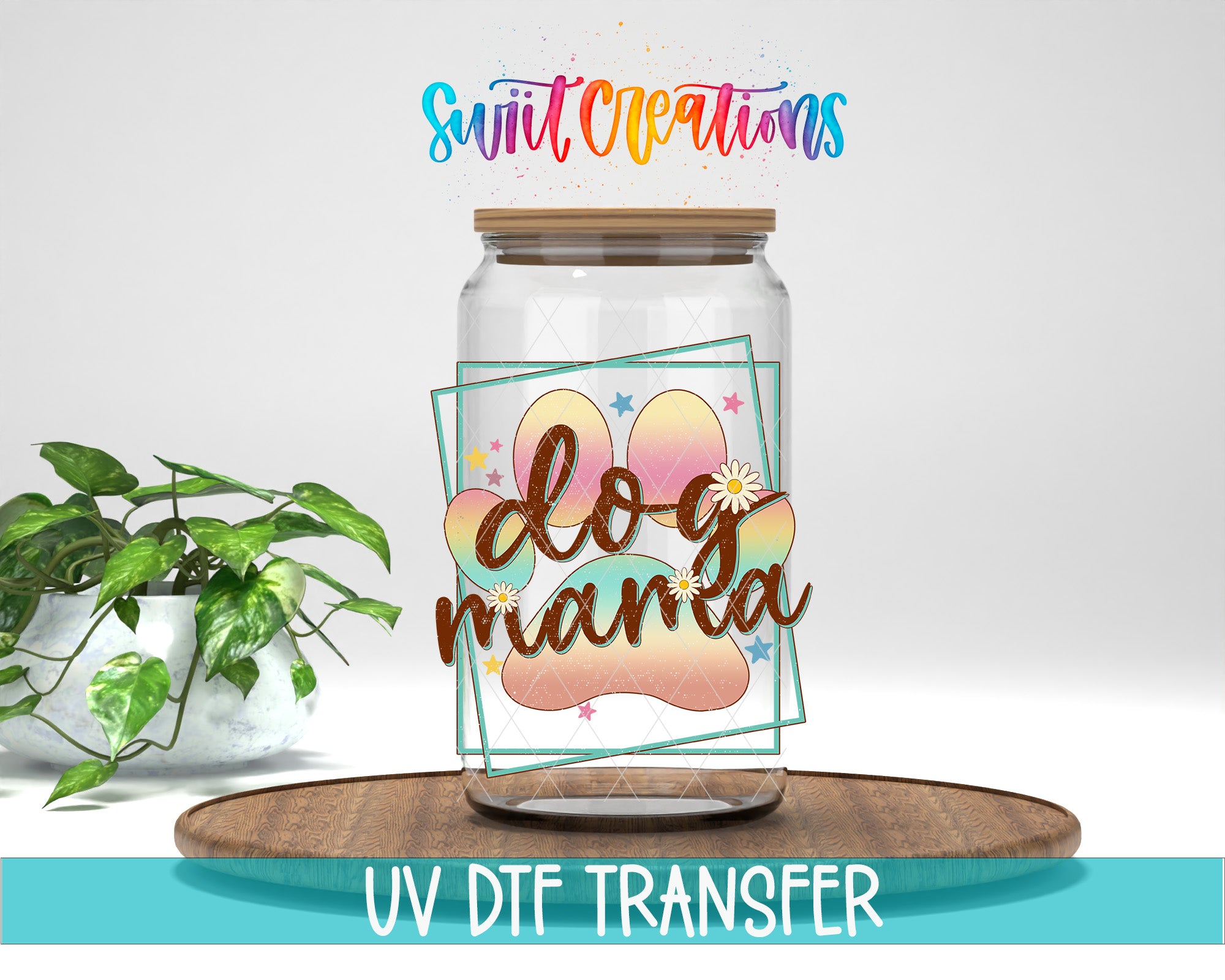 a glass jar with a dog paw design and the text "dog mama" on it, placed on a wooden surface. There is also a potted plant in the background.