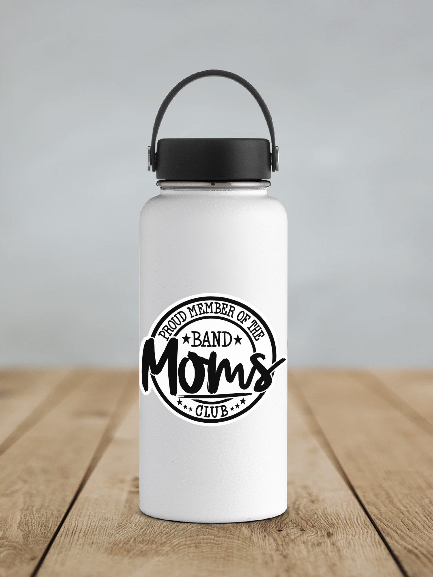 a white water bottle sitting on top of a wooden table