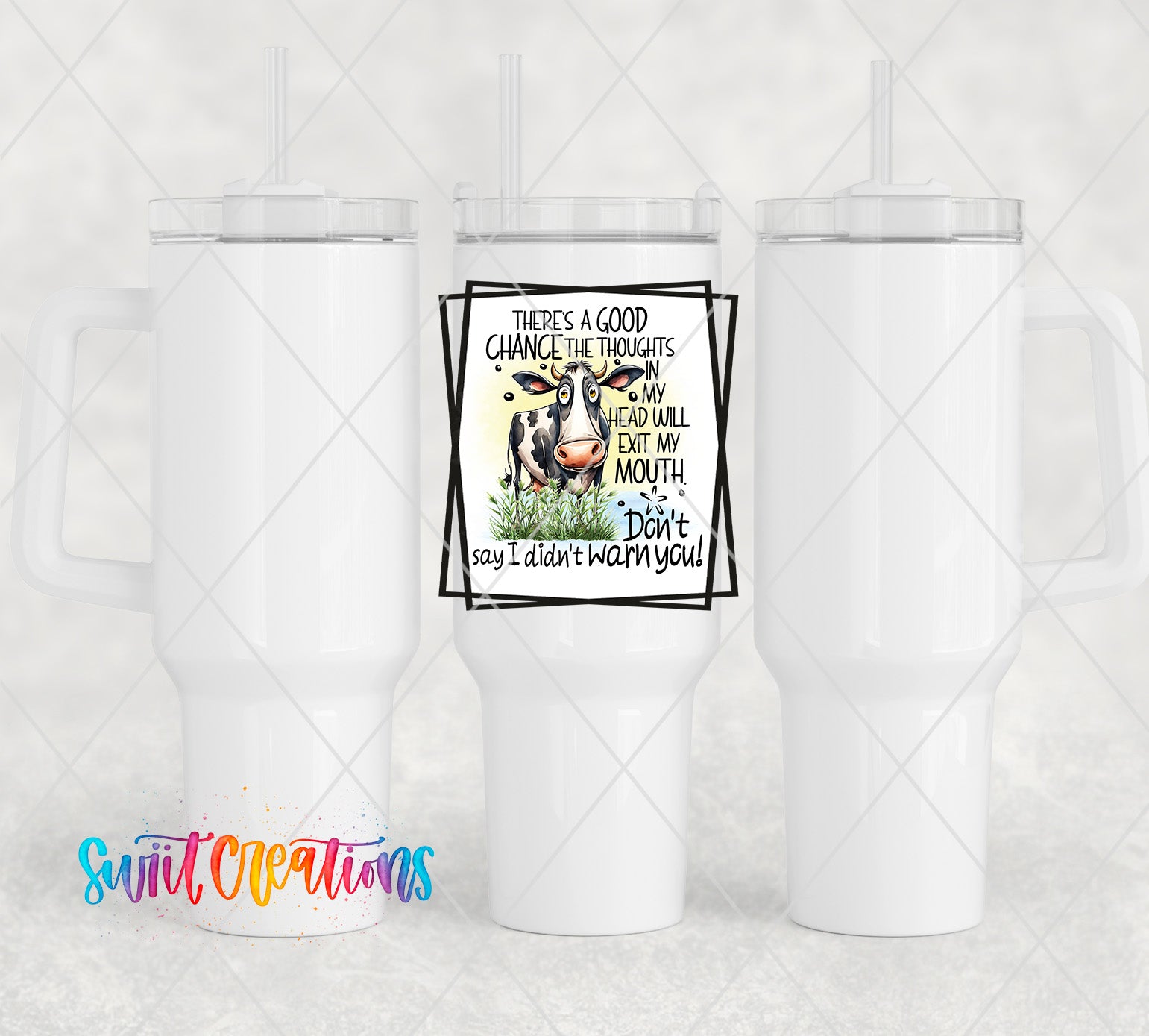 two white coffee mugs with a picture of a cow