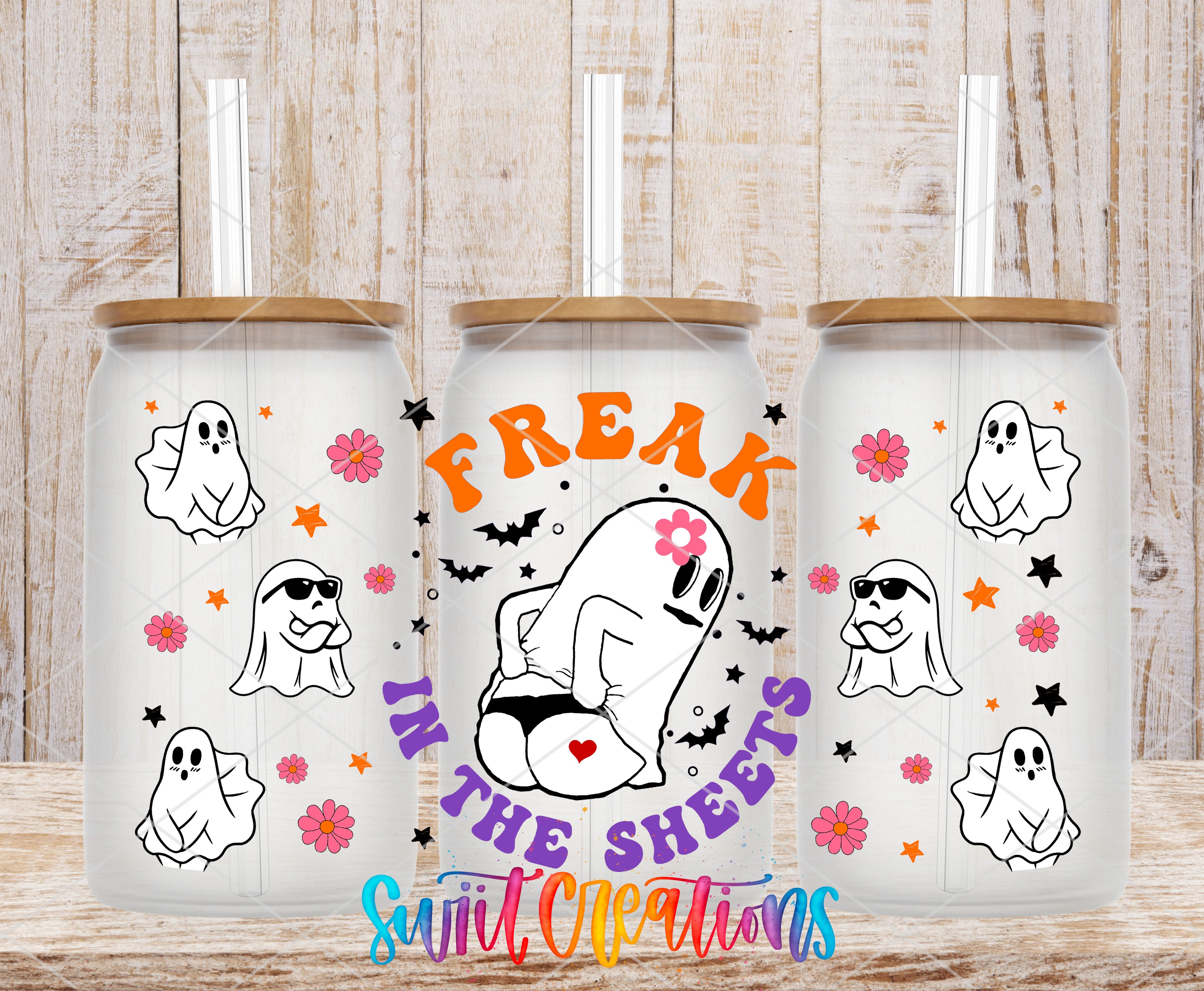 three glass tumblers with a Halloween-themed design. The tumblers are decorated with ghost characters, flowers, and stars, and the text "Freak in the sheets" is displayed prominently.