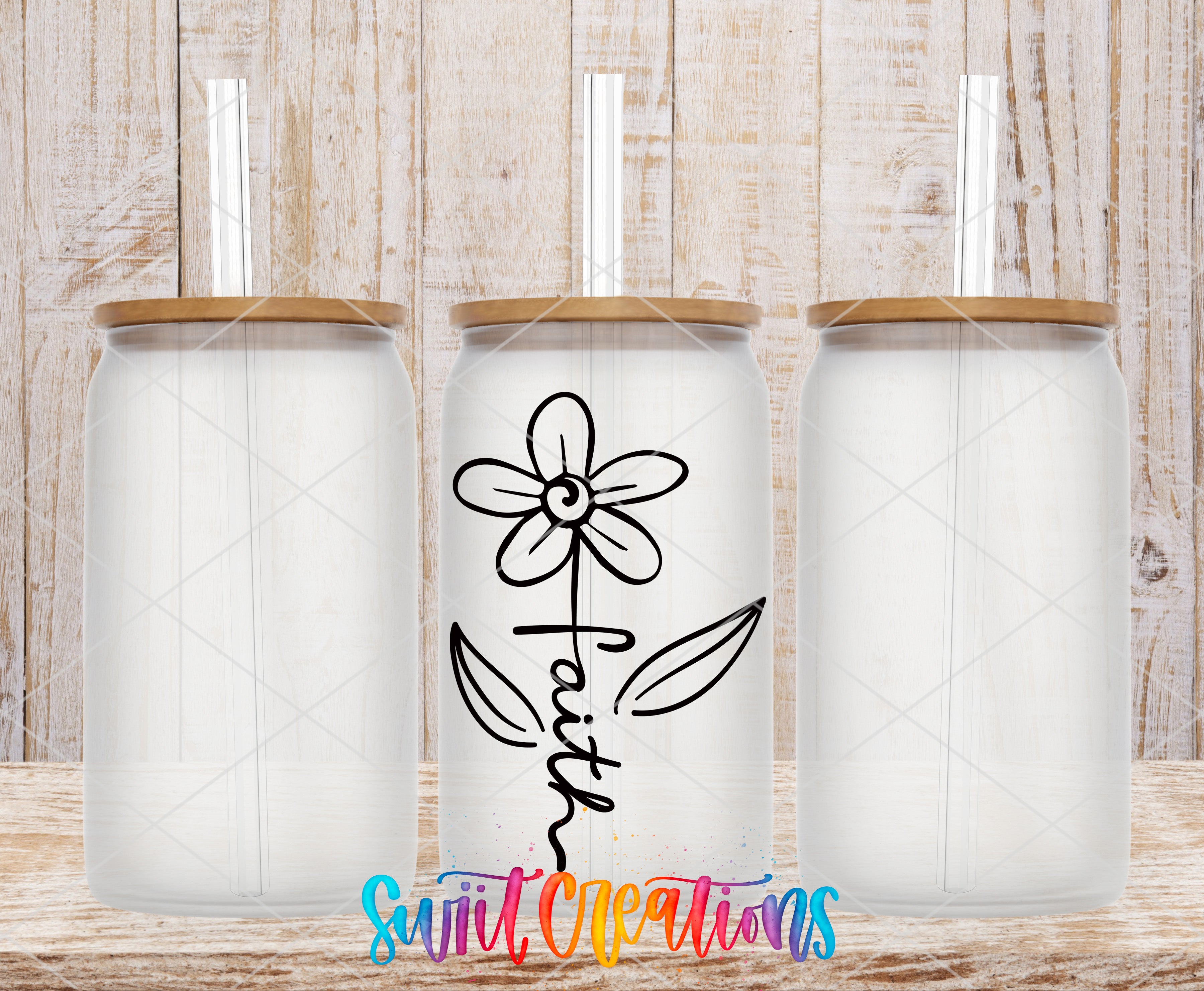 three white glass jars with wooden lids, each with a straw sticking out of the top. The jars are arranged in a row, with the middle one having a flower design on it. The background is a wooden wall with a textured appearance.